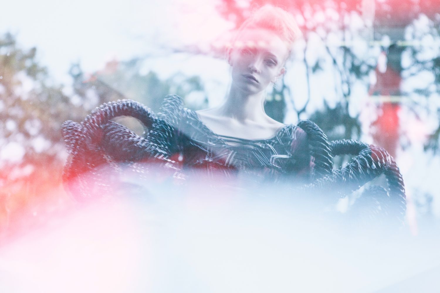 Dreamy double exposure photograph with pink and blue color effects.