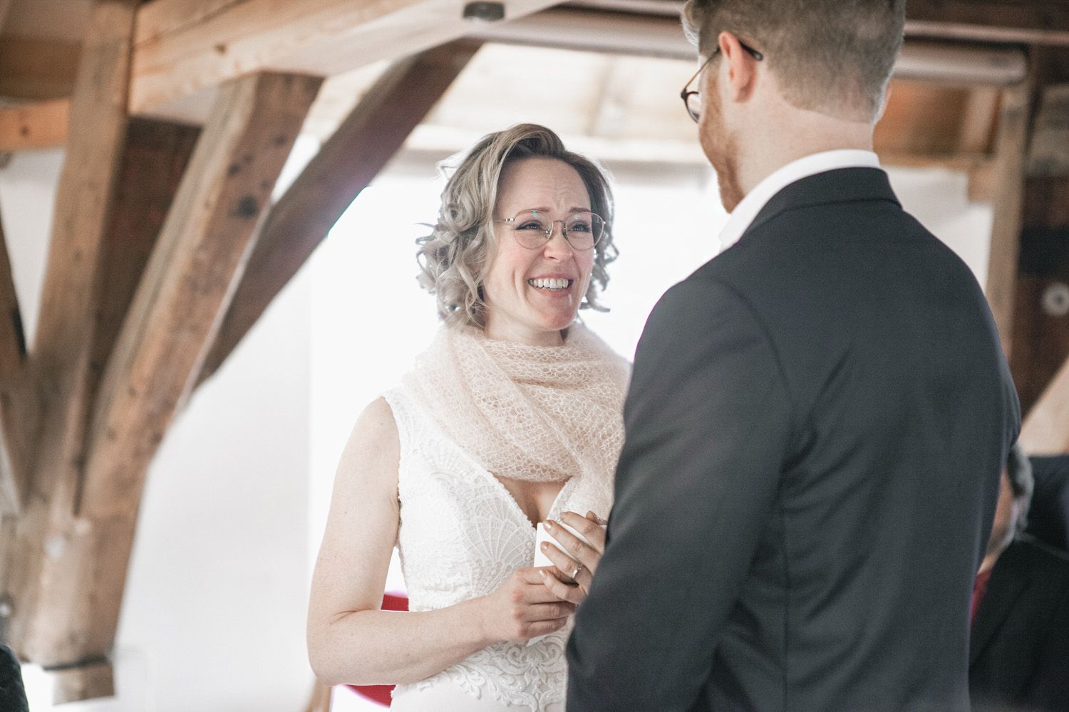 A bride and groom share a tender moment and toast during their wedding reception.
