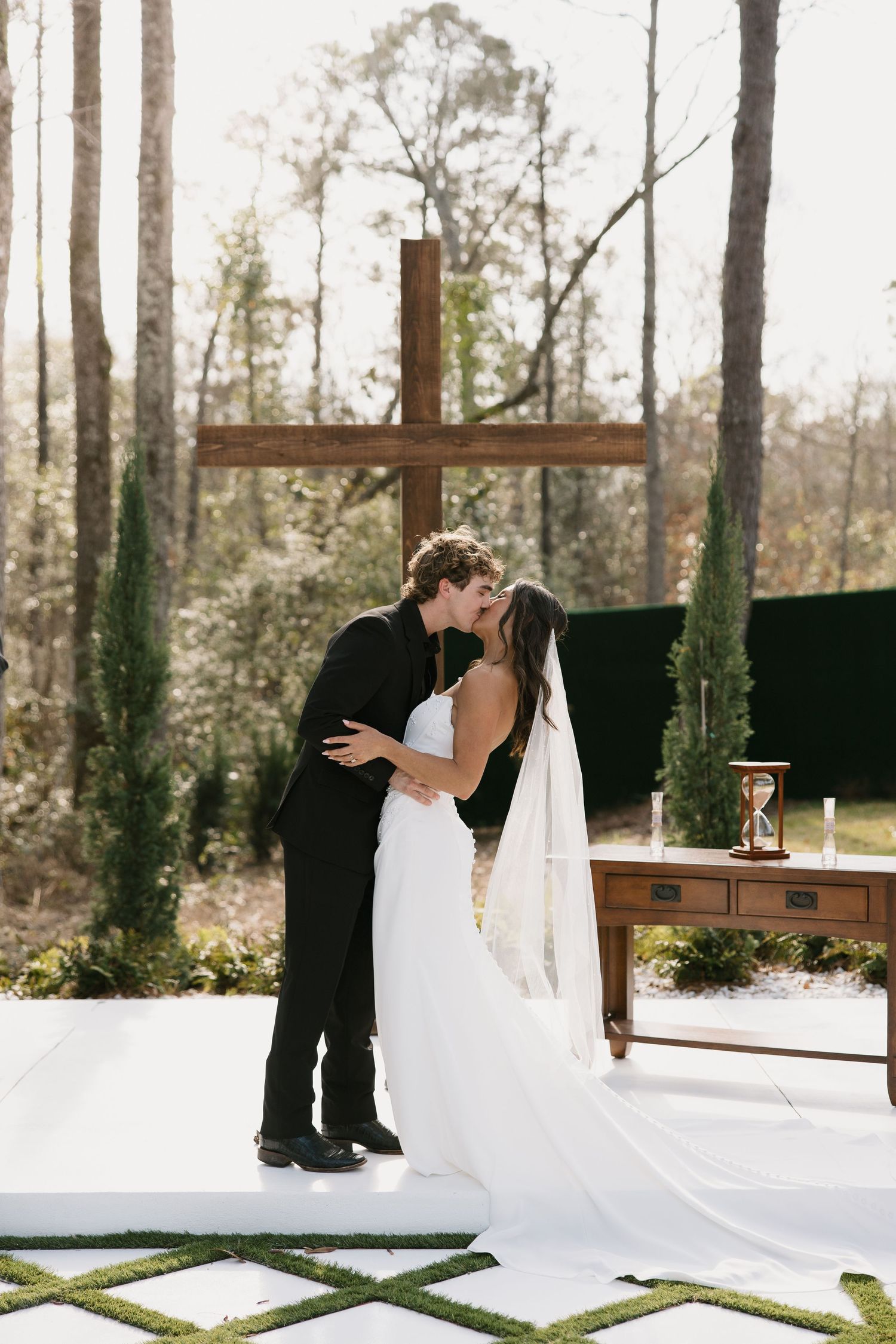 A romantic outdoor wedding scene with couple sharing intimate moments across four photos in a natural pine forest setting.