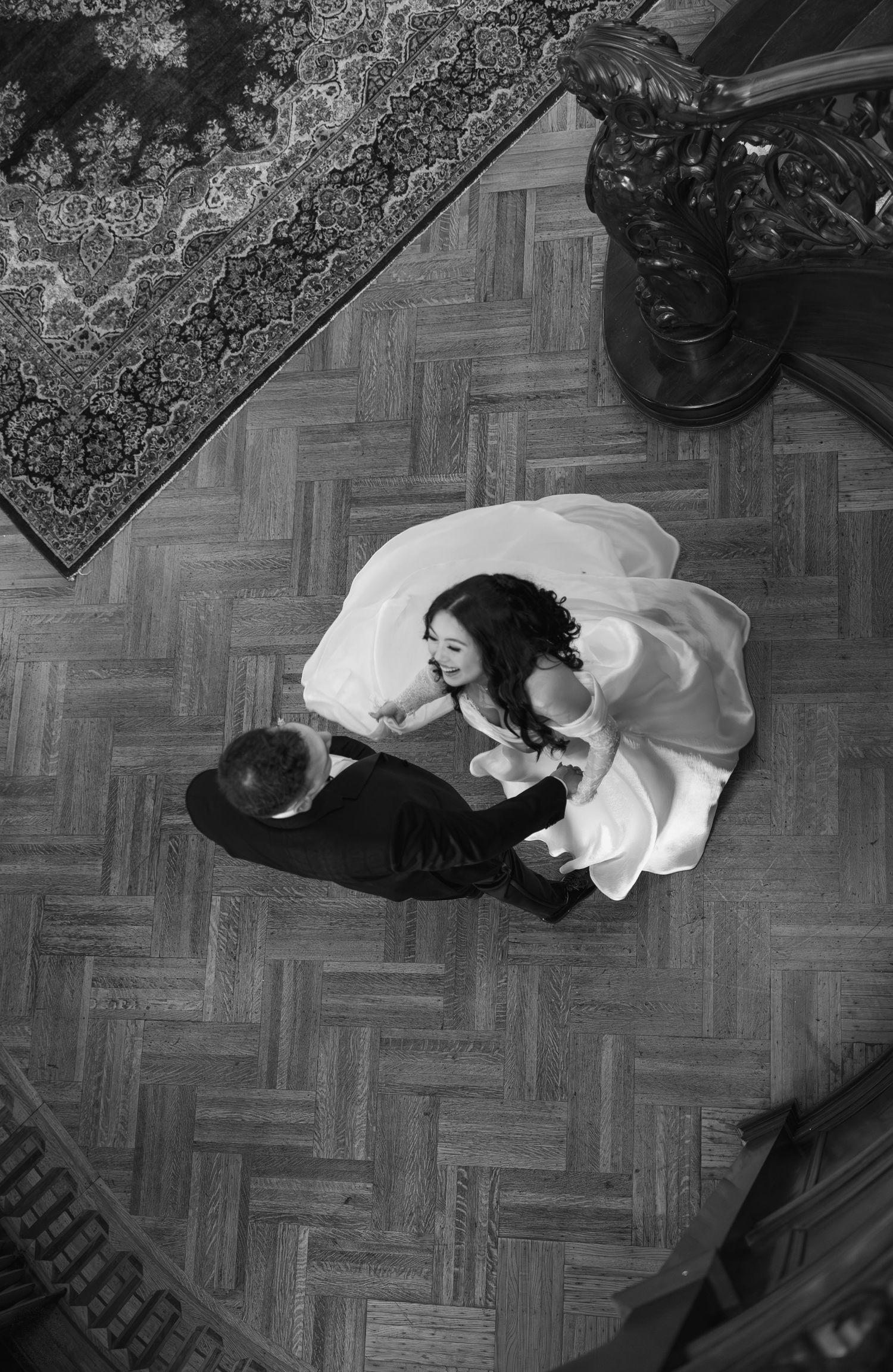 A black and white photo sequence shows a figure in white clothing performing a rolling movement across a patterned floor.