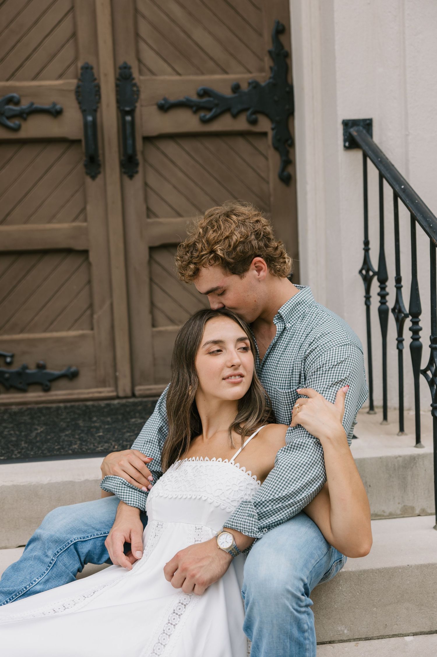 A couple shares tender moments while sitting on concrete steps, shown in a series of romantic images.