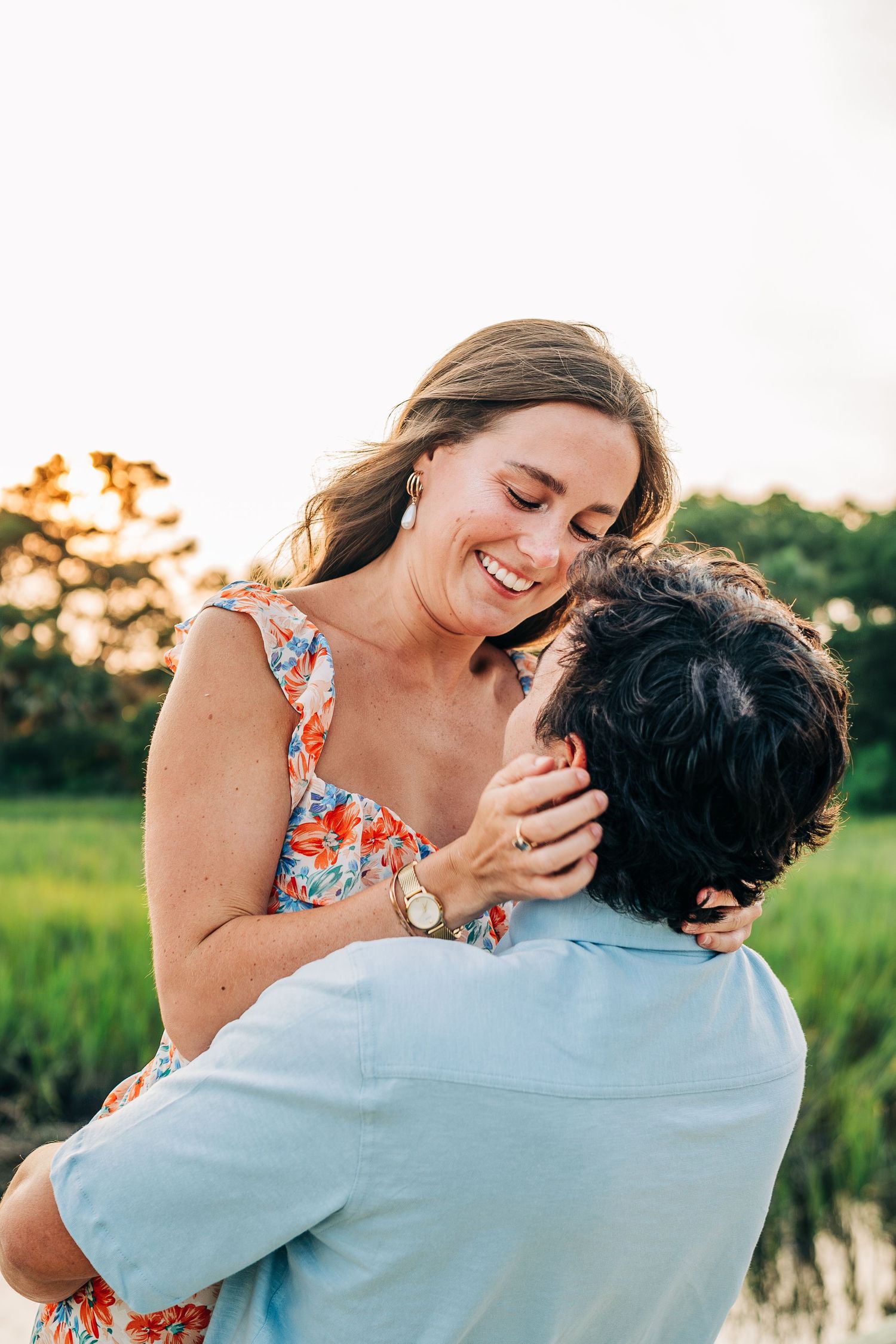 Candid moments of couple laughing and embracing outdoors with natural lighting.