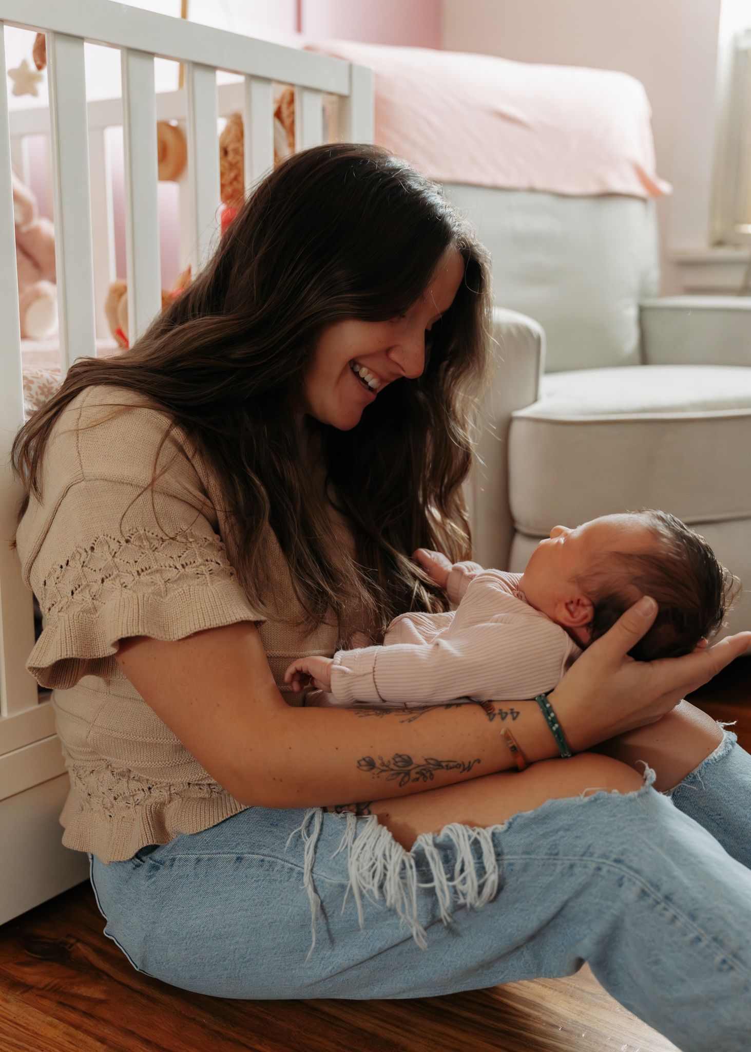 A series of tender moments showing a couple cuddling and embracing on a couch in casual denim and white clothing.
