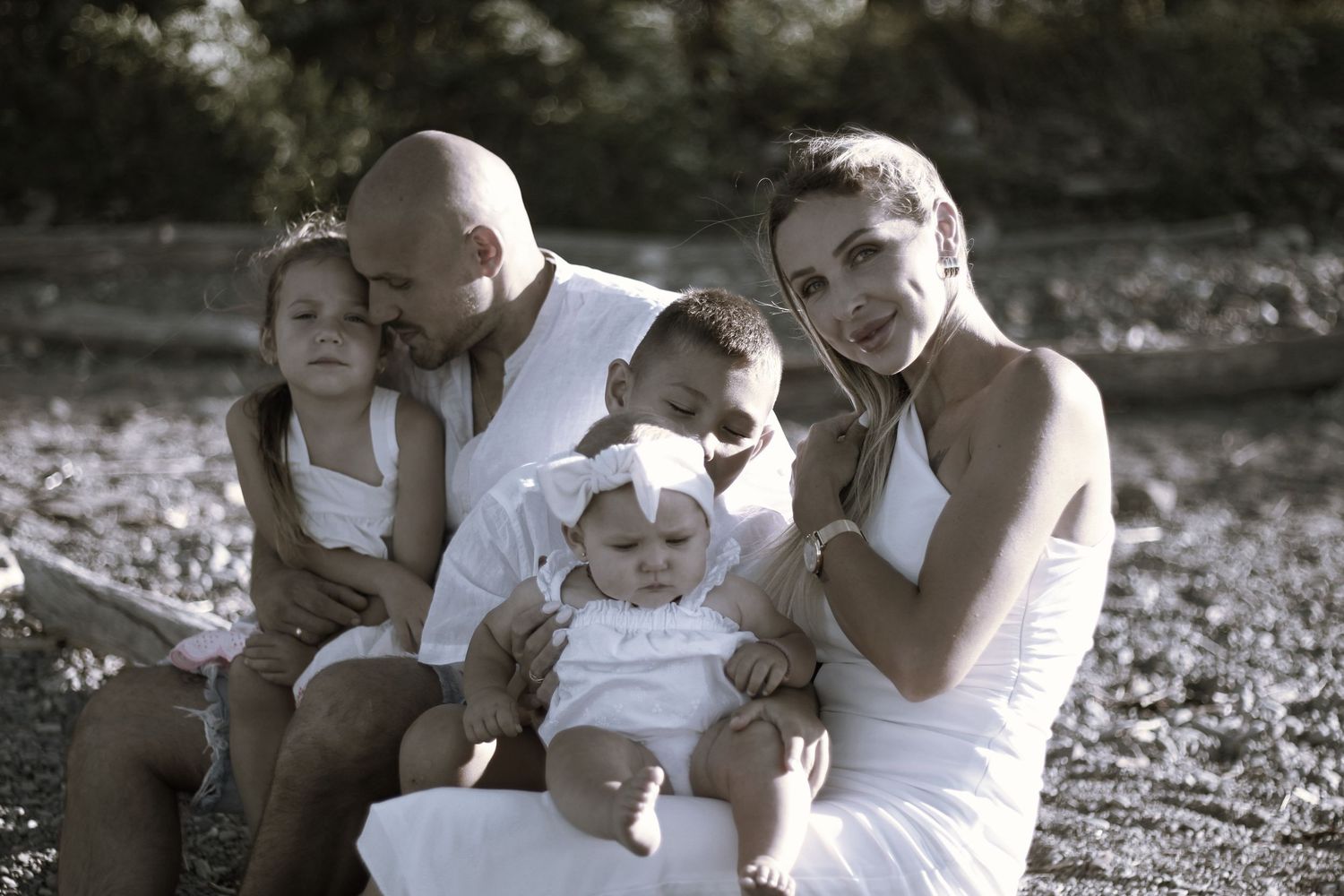 family beach photoshoot, black and white photos. all white beach outfits.