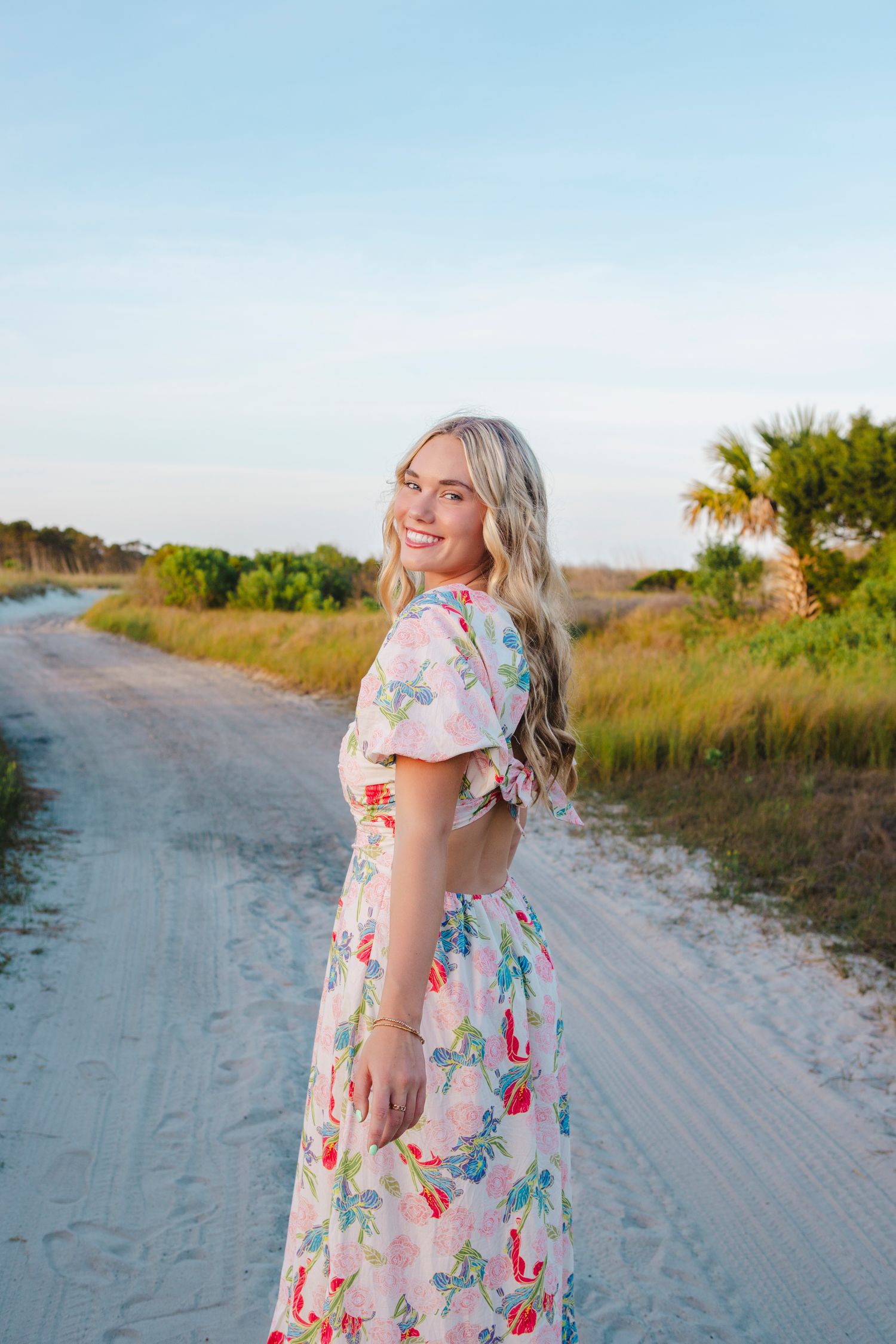 Senior Portrait of Leah class of 2024. Location Burks Beach Hilton Head Island, SC. Sunset. Colorful dress. Dunes.