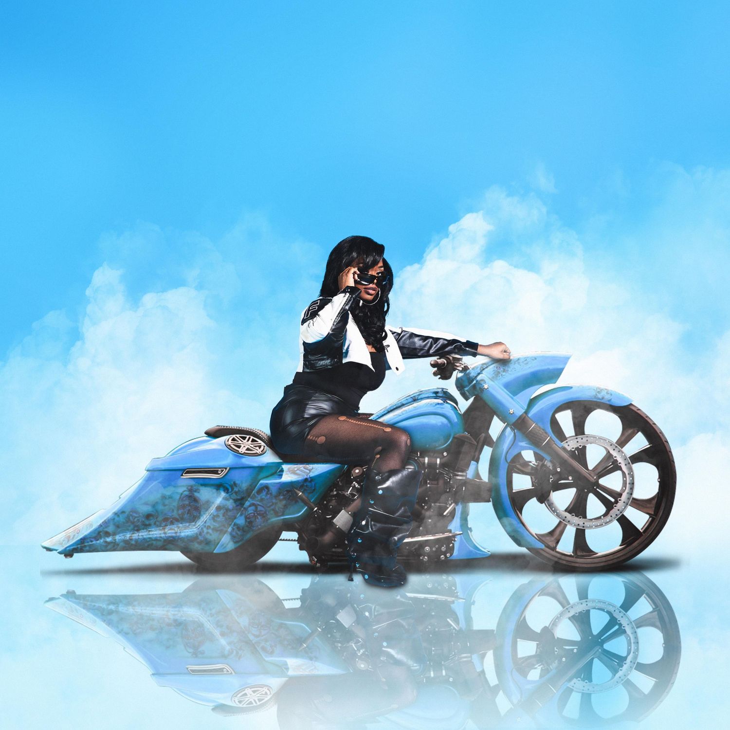 Woman riding blue custom motorcycle against cloudy sky background.