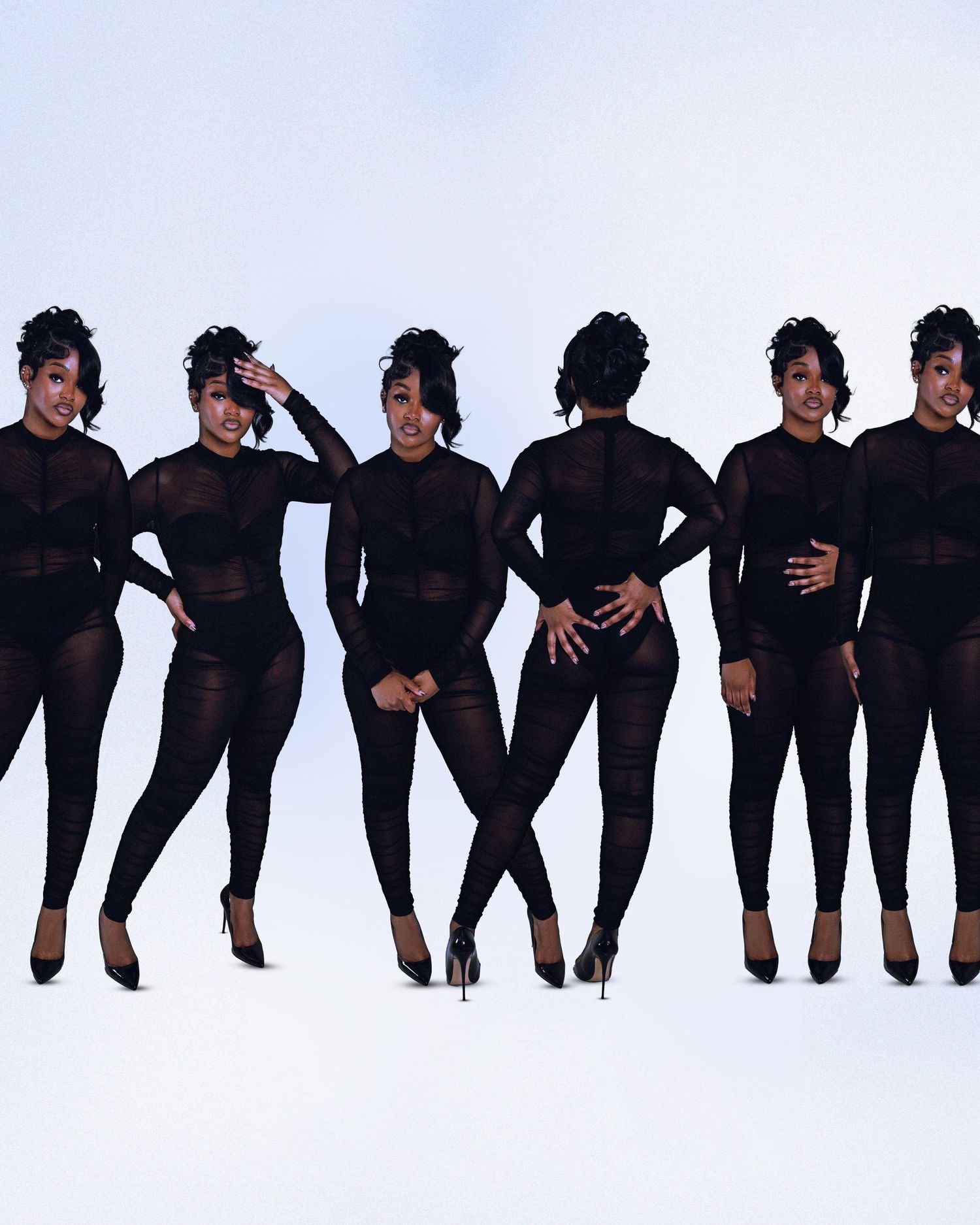 Six women in matching black mesh jumpsuits posing confidently against a white studio background.