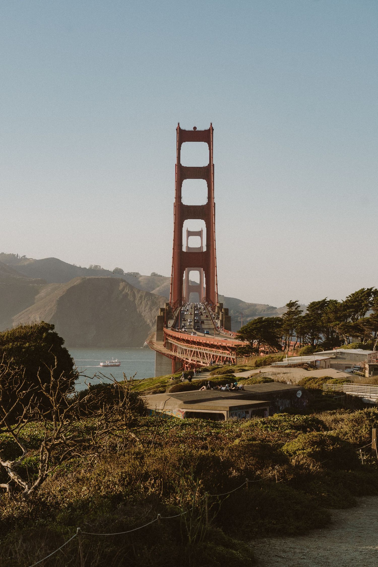 A series of Golden Gate Bridge photos from different angles showing the iconic San Francisco landmark at sunset.