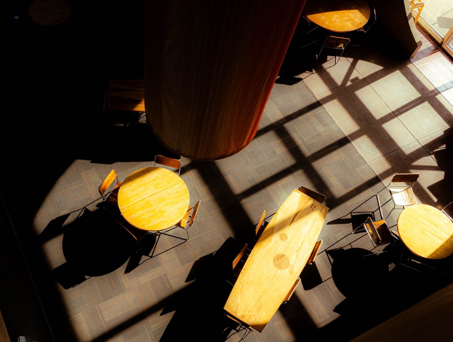 The dining area of an Arizona hotel, viewed from above, with natural light creating a welcoming environment.