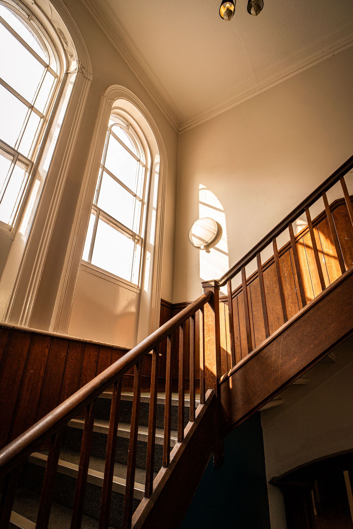 Hotel stairway flooded with warm natural light
