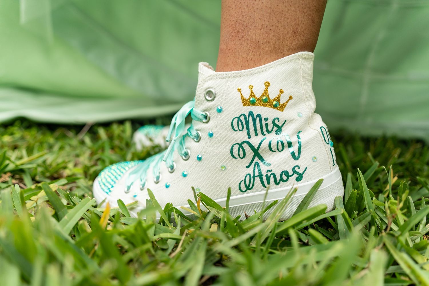 White high-top Converse sneakers customized with 