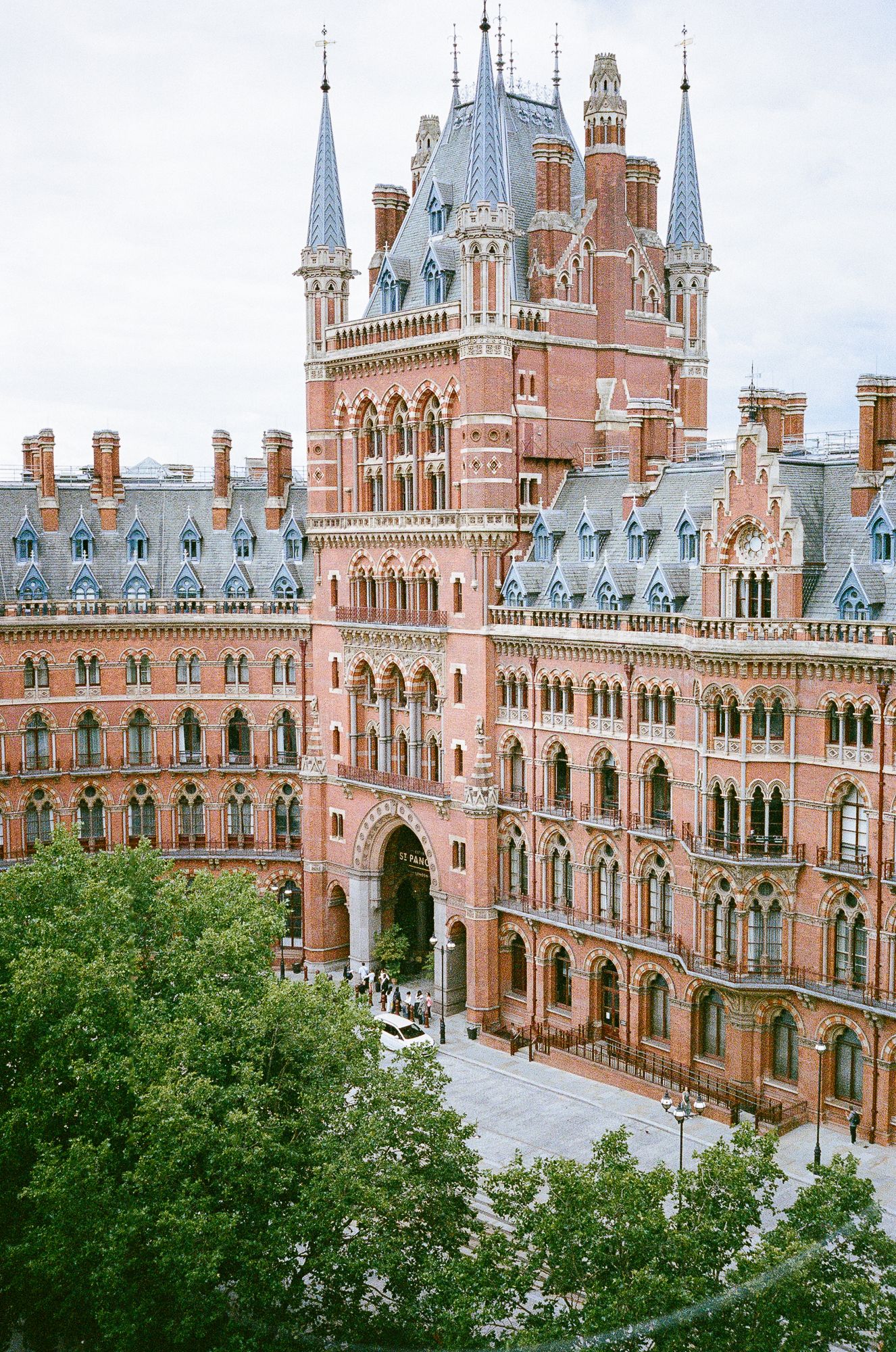 Exterior view of St Pancras Renaissance Hotel in London showing its iconic Victorian Gothic architecture and red brick facade.