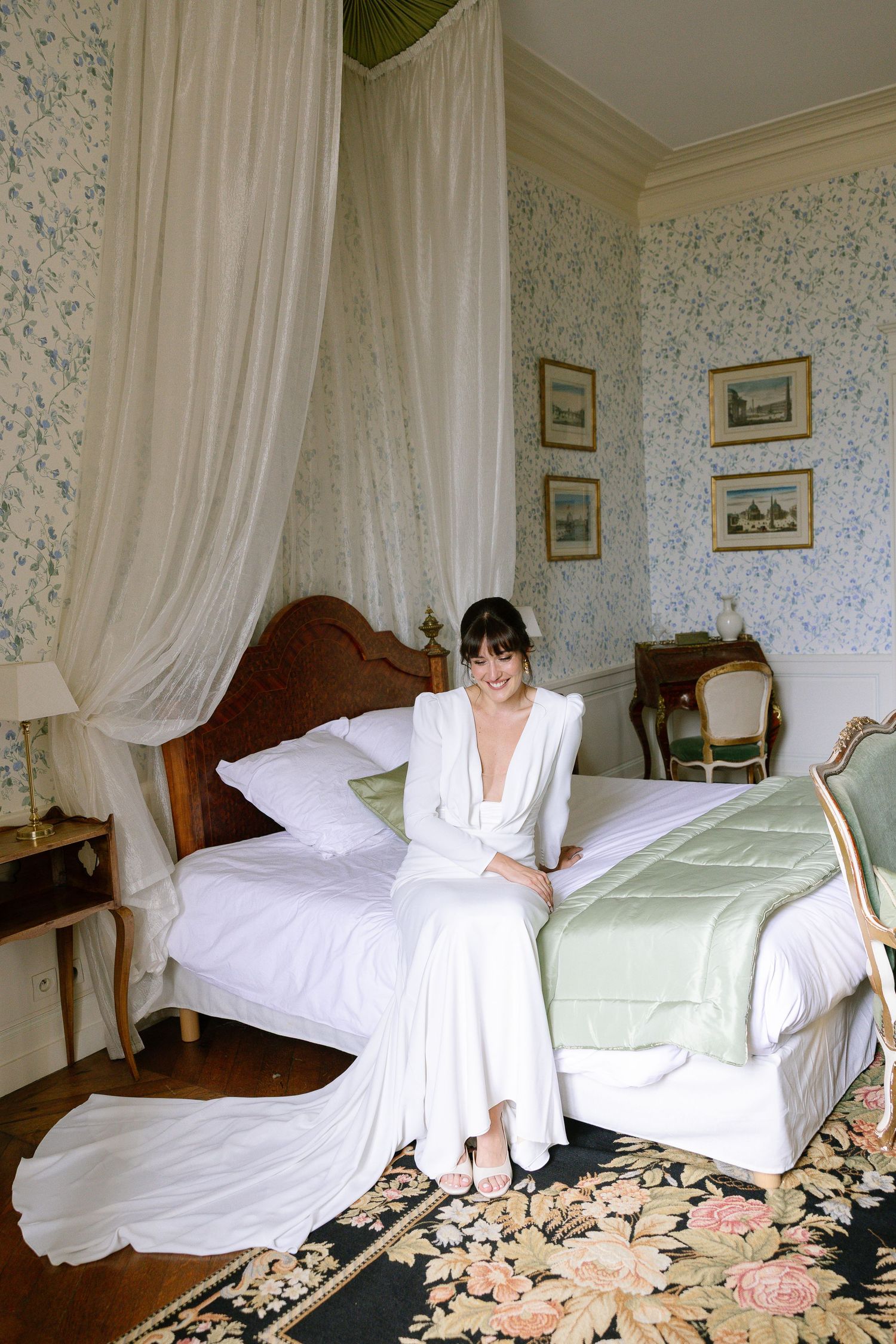 Four sequential photos showing someone making a bed with white linens and floral carpet in an elegant bedroom.