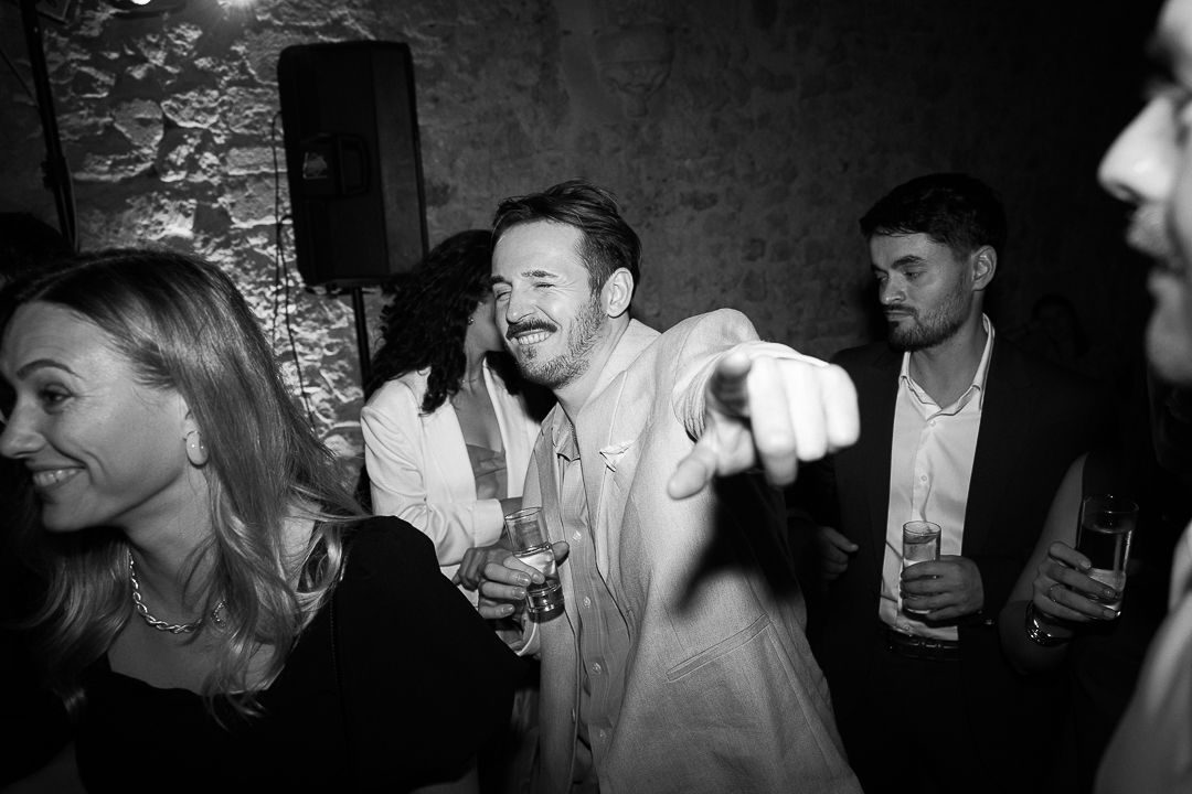 A black and white photo montage showing people enjoying drinks and socializing at what appears to be a bar or party.