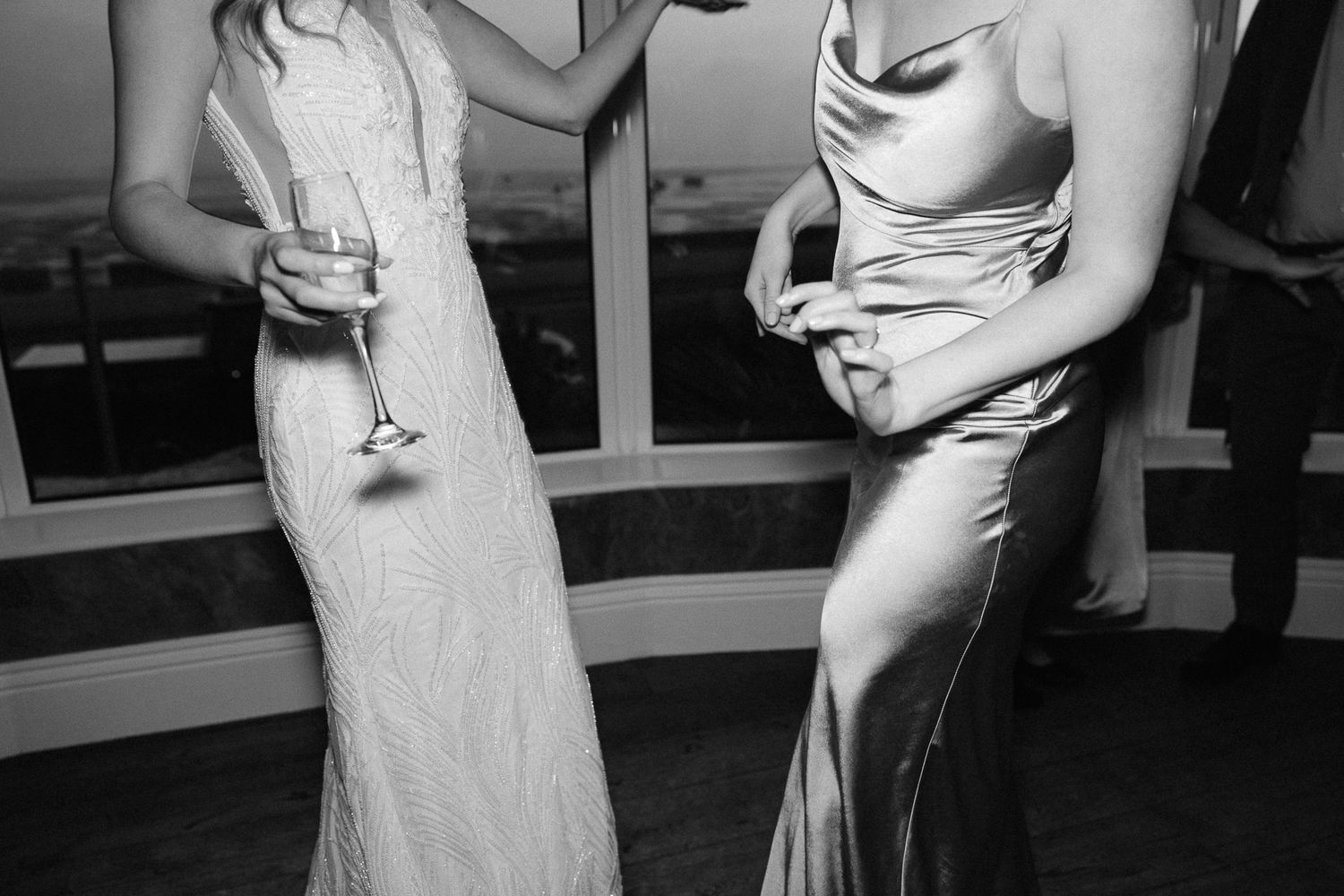 A black and white photo montage showing people in formal attire at what appears to be a wedding reception or party.