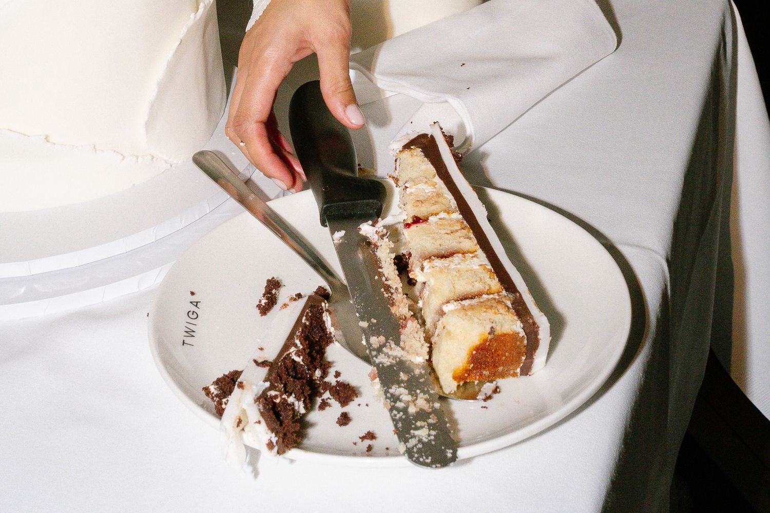 A sequence of images showing someone eating a slice of cake using a fork on a white plate.