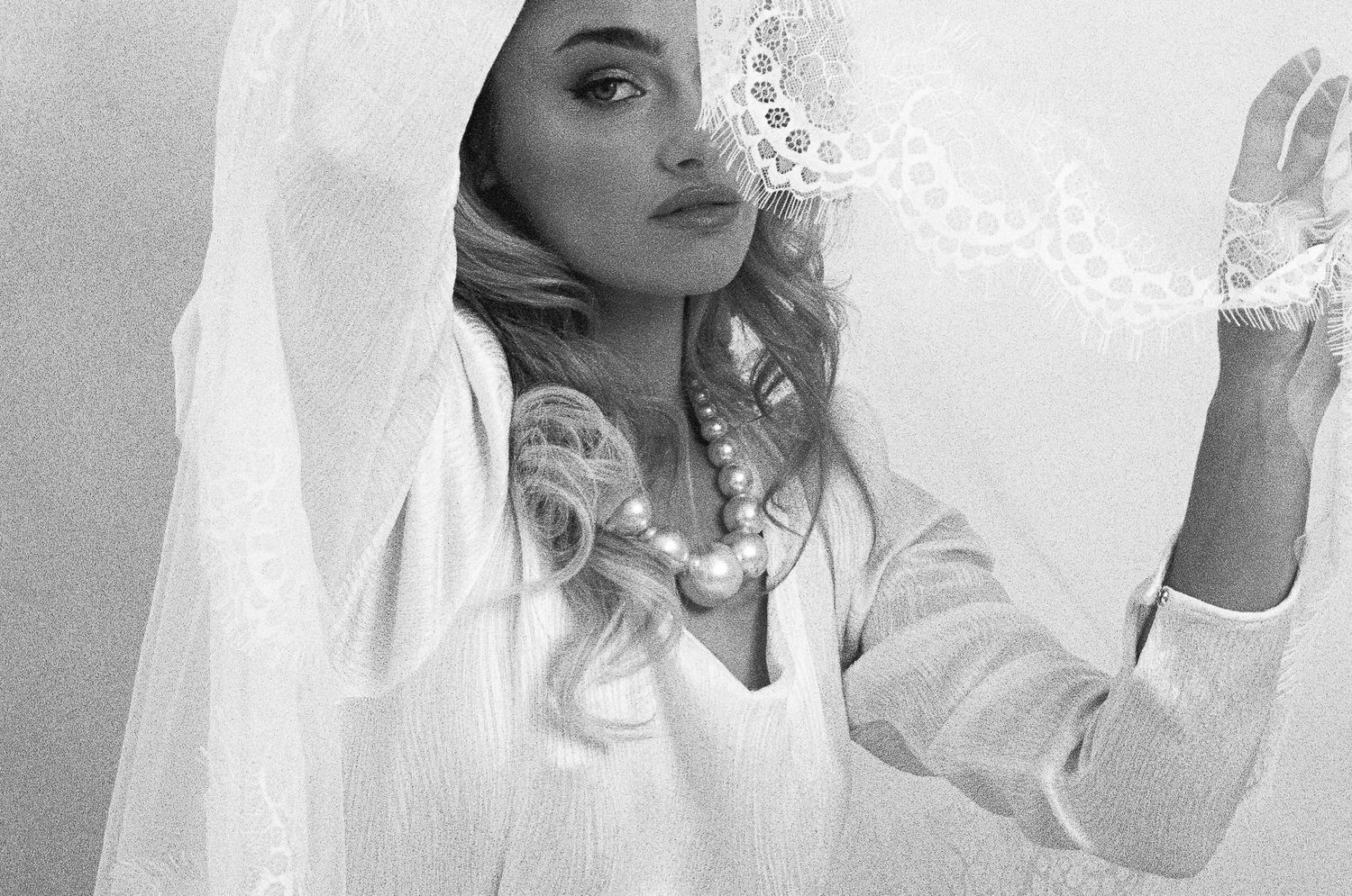 A series of black and white bridal portraits showing close-up shots in soft, ethereal lighting.