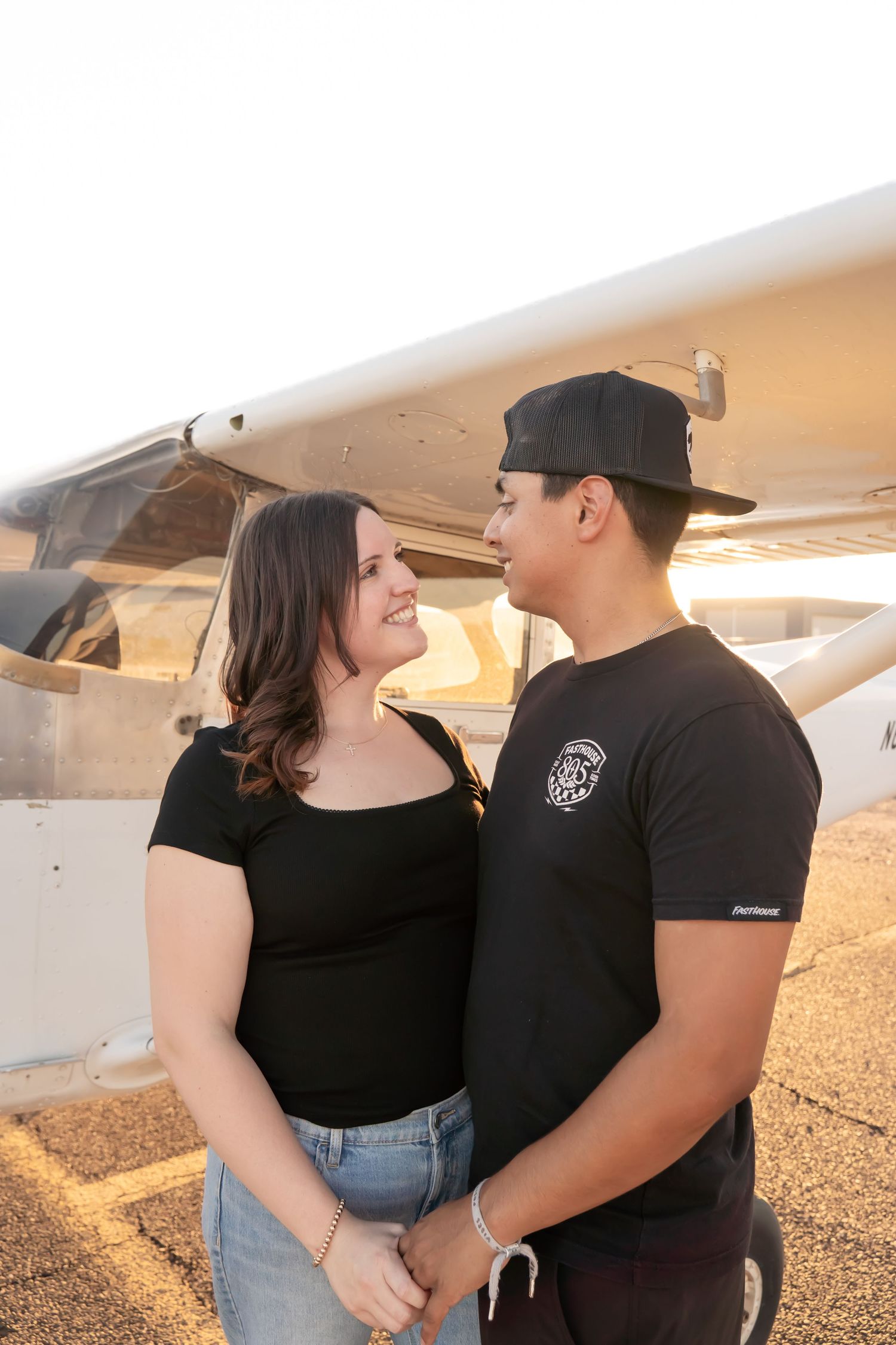 Couples photography with aviation theme in Phoenix Arizona, capturing authentic, natural moments by Photos X Gwen