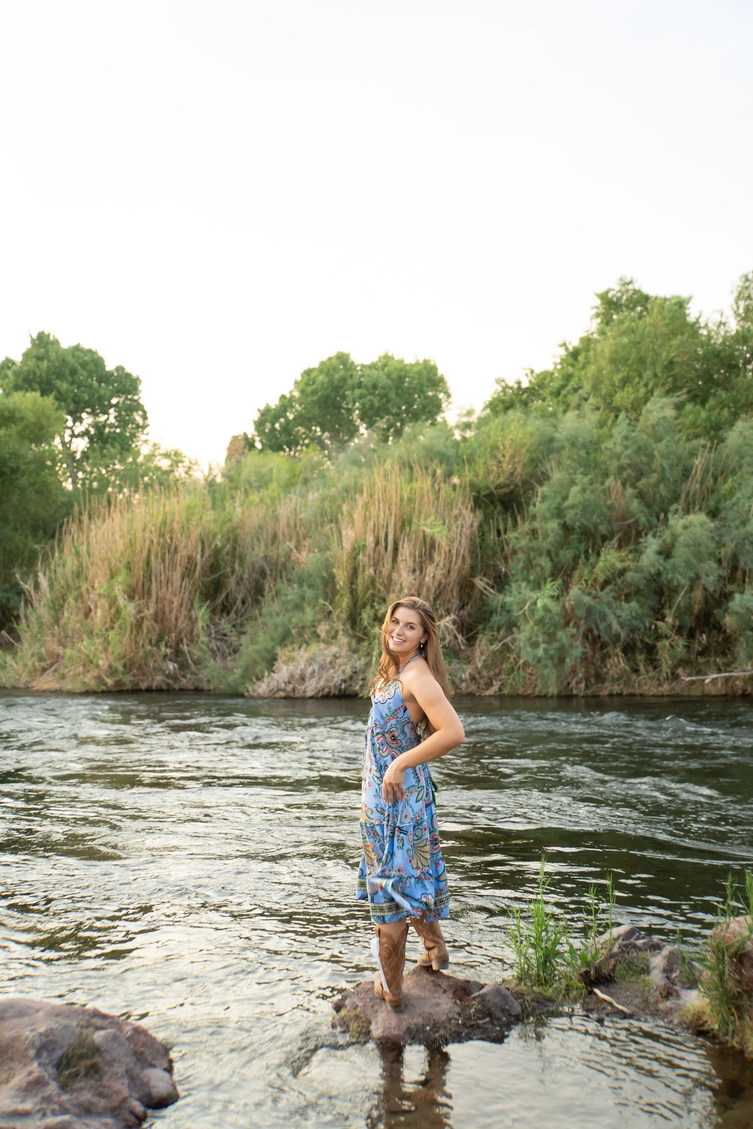 Senior portrait session at Salt River, Arizona, capturing authentic, natural moments with scenic desert and river landscapes