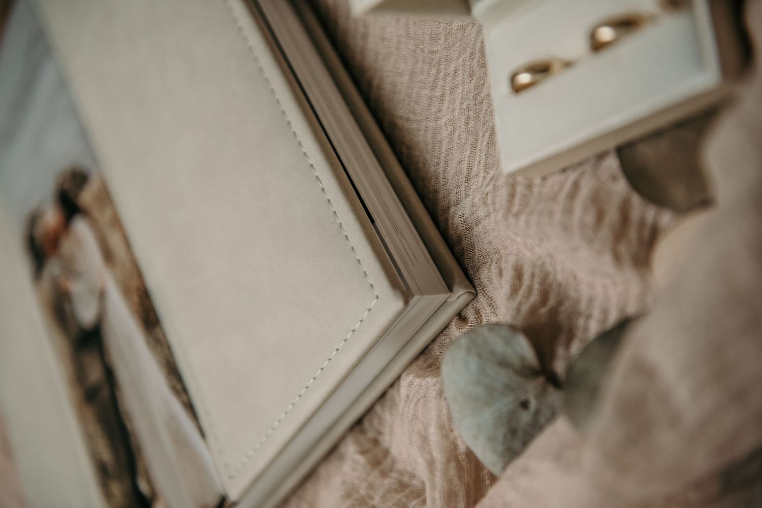 Detail of an elegant photo album corner with decorative stitching.