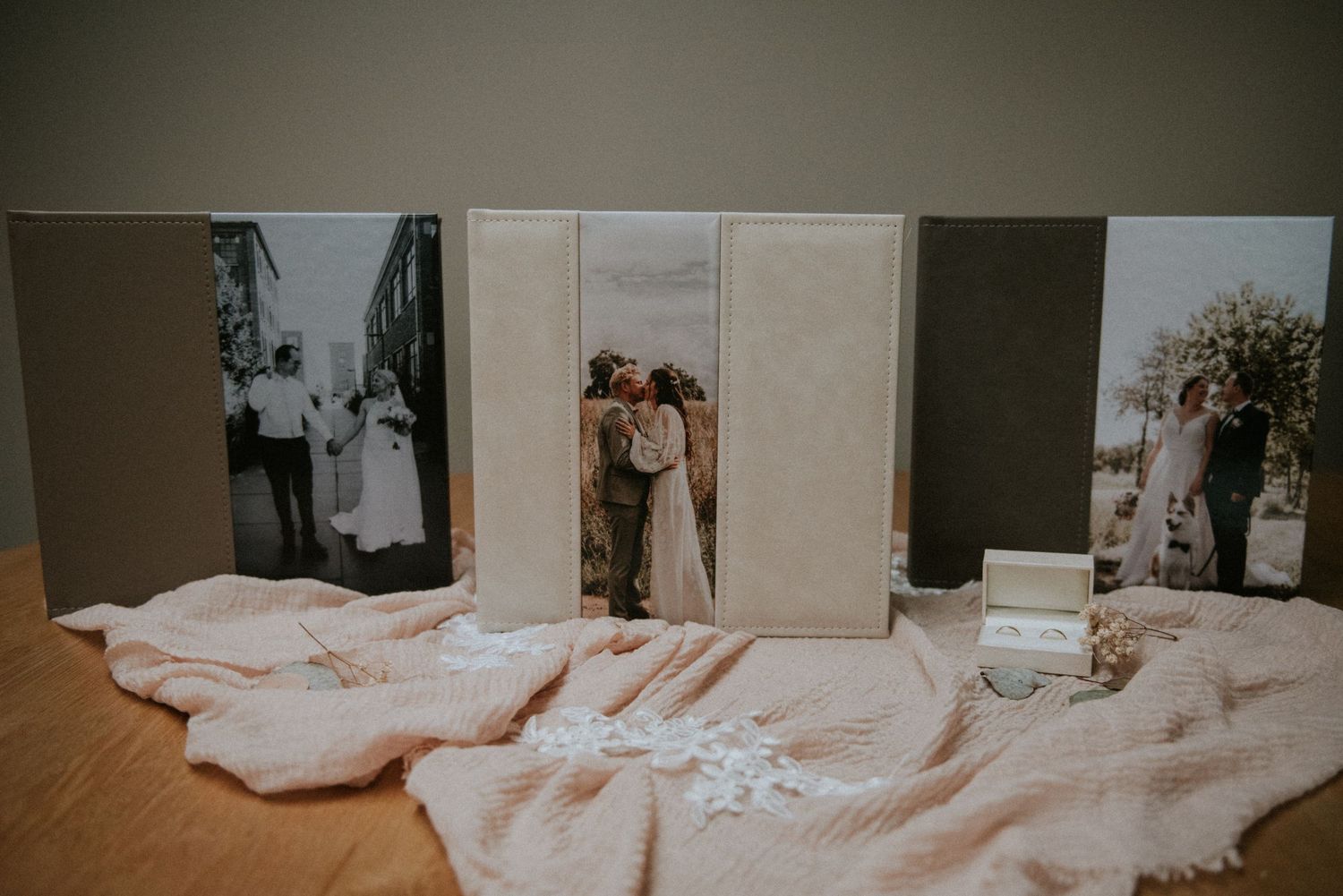 A collection of vintage photographs displayed on a white surface with soft lighting.