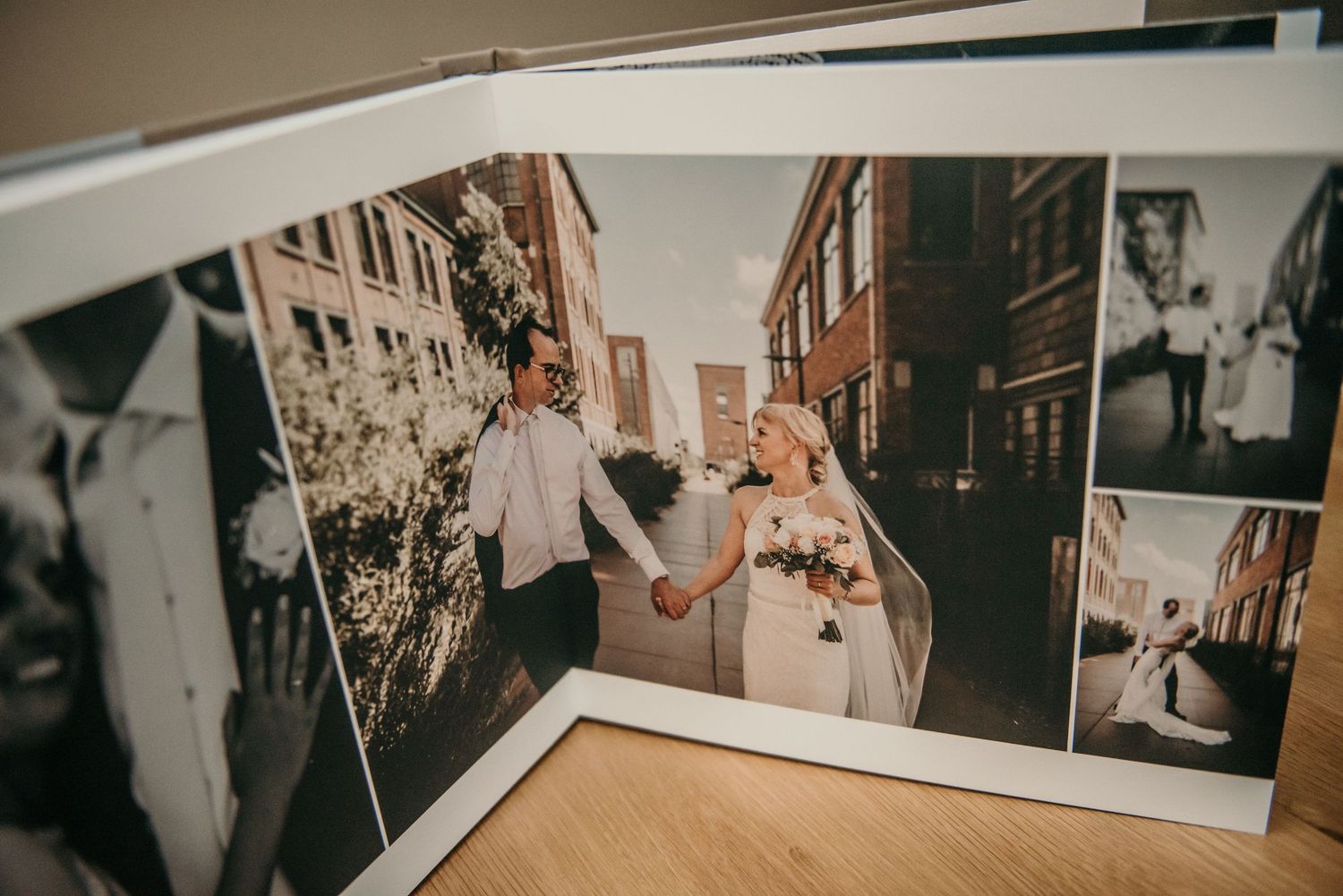 Wedding photo album displaying multiple artistic shots in sequence.