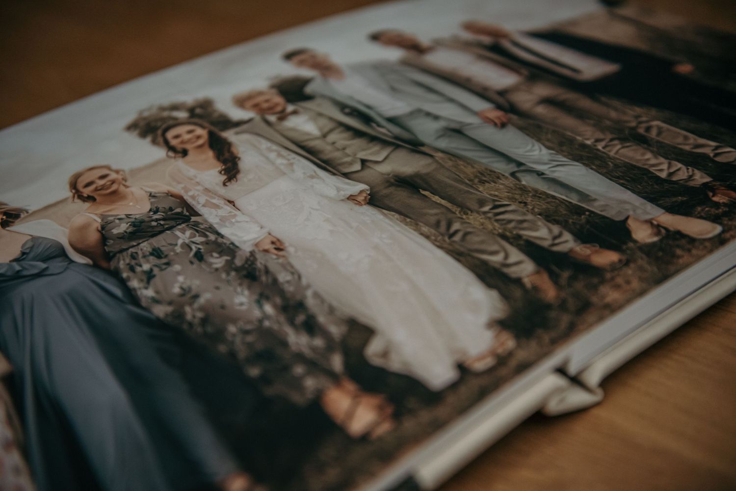 Wedding photo album spread displaying artistic photography layouts.