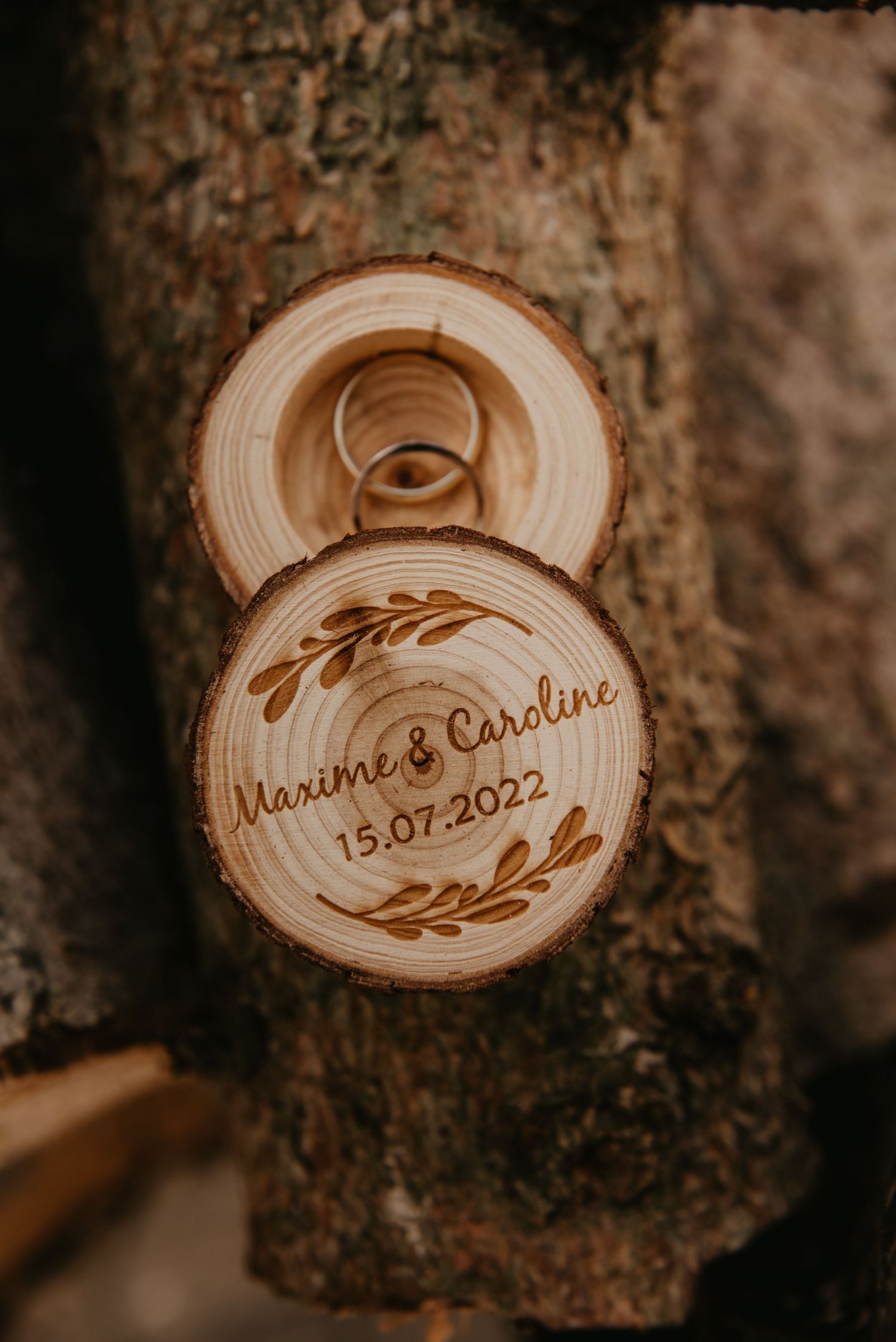 Wooden disc wedding favor with names and date burned into surface.