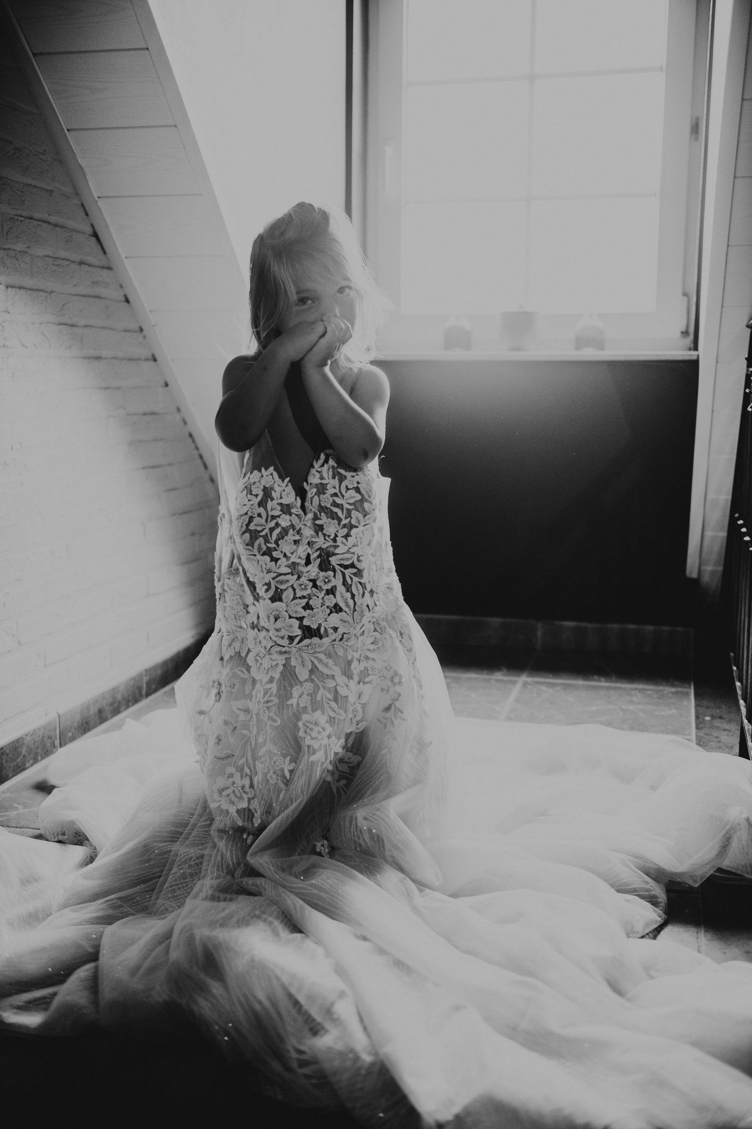 Artistic black and white photos of wedding dress details and lace.