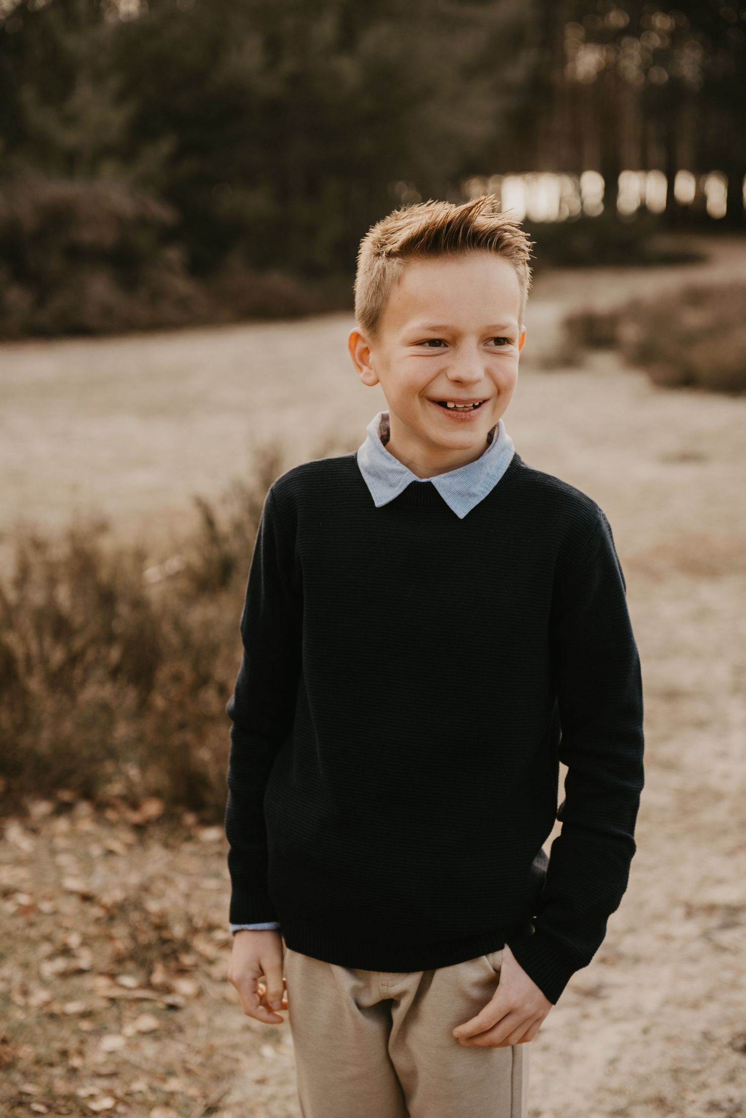 Candid outdoor portrait session in warm autumn lighting.