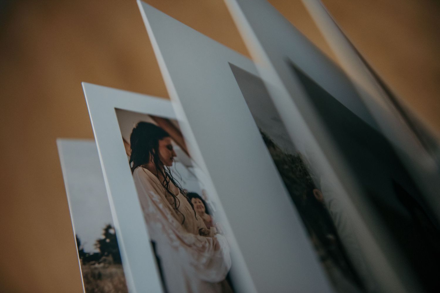 Open photo album with artistic black and white images displayed.