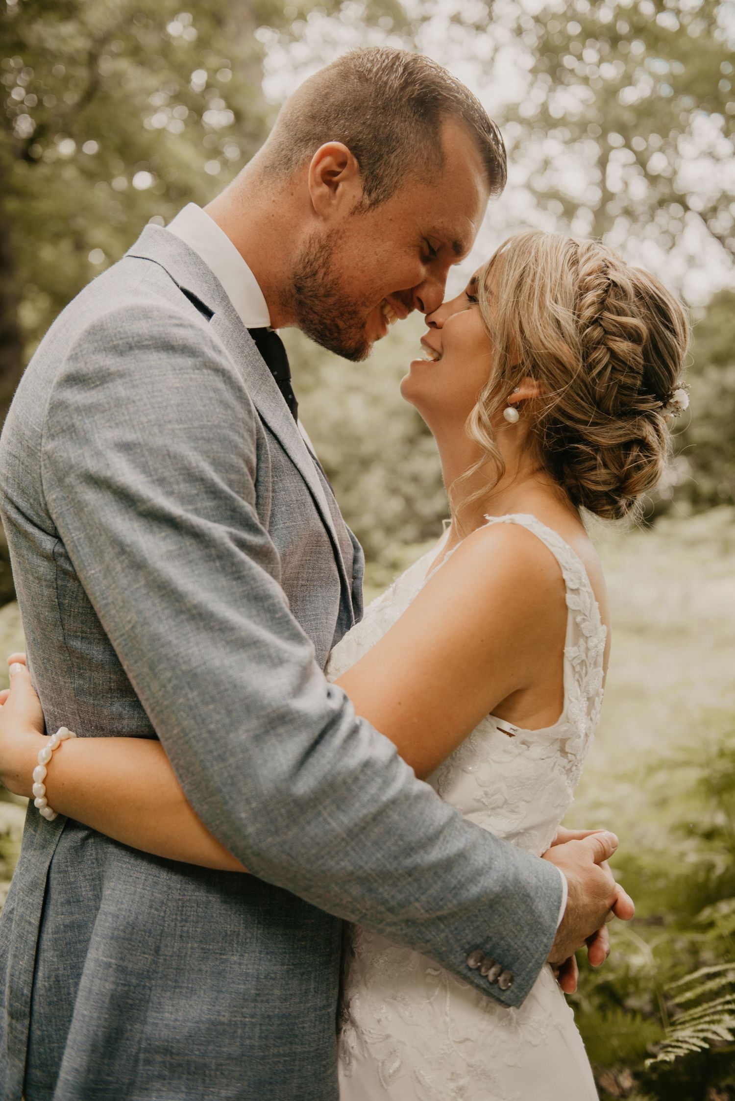 Intimate wedding couple portraits captured in a romantic outdoor setting.