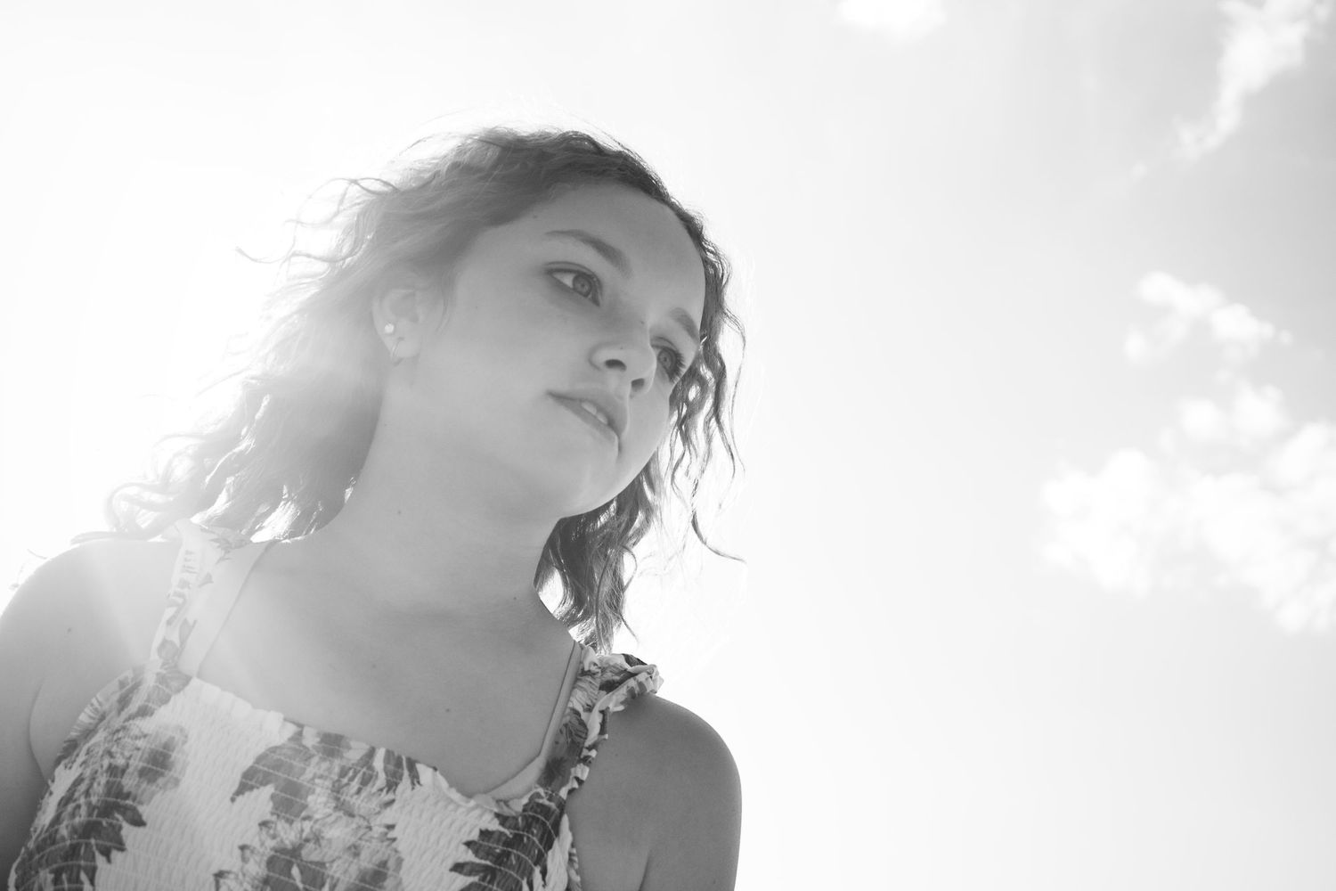 Black and white artistic headshots showing dramatic side profiles against contrasting light and shadow effects.