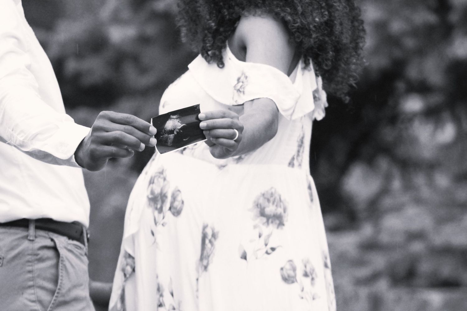 Black and white portrait series showing intimate wedding moments.