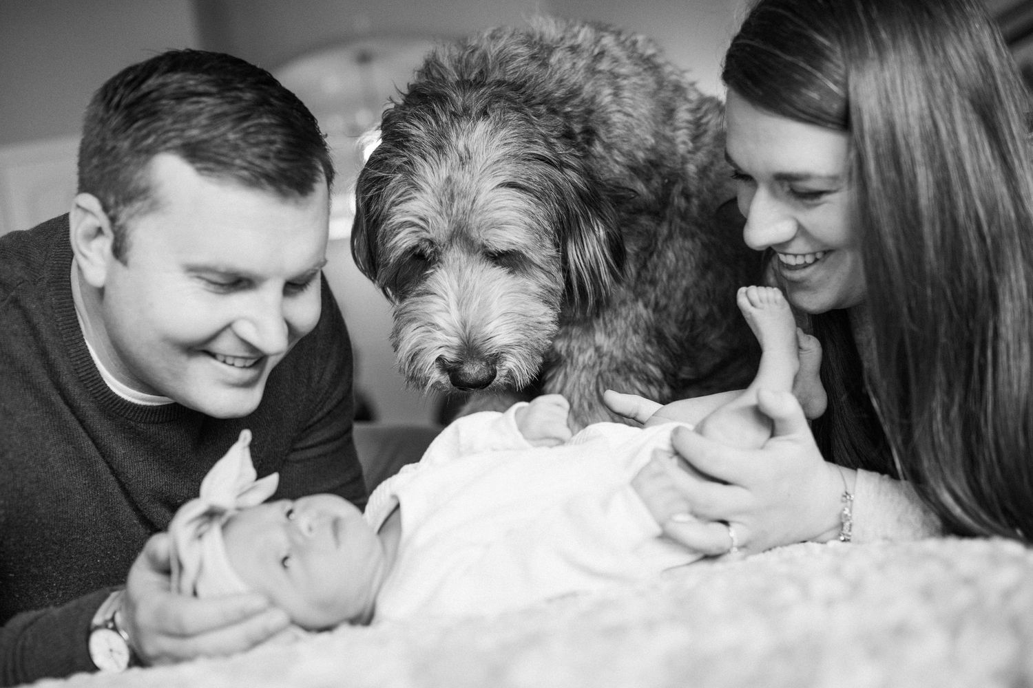 A series of black and white romantic photos showing tender intimate moments between a couple.