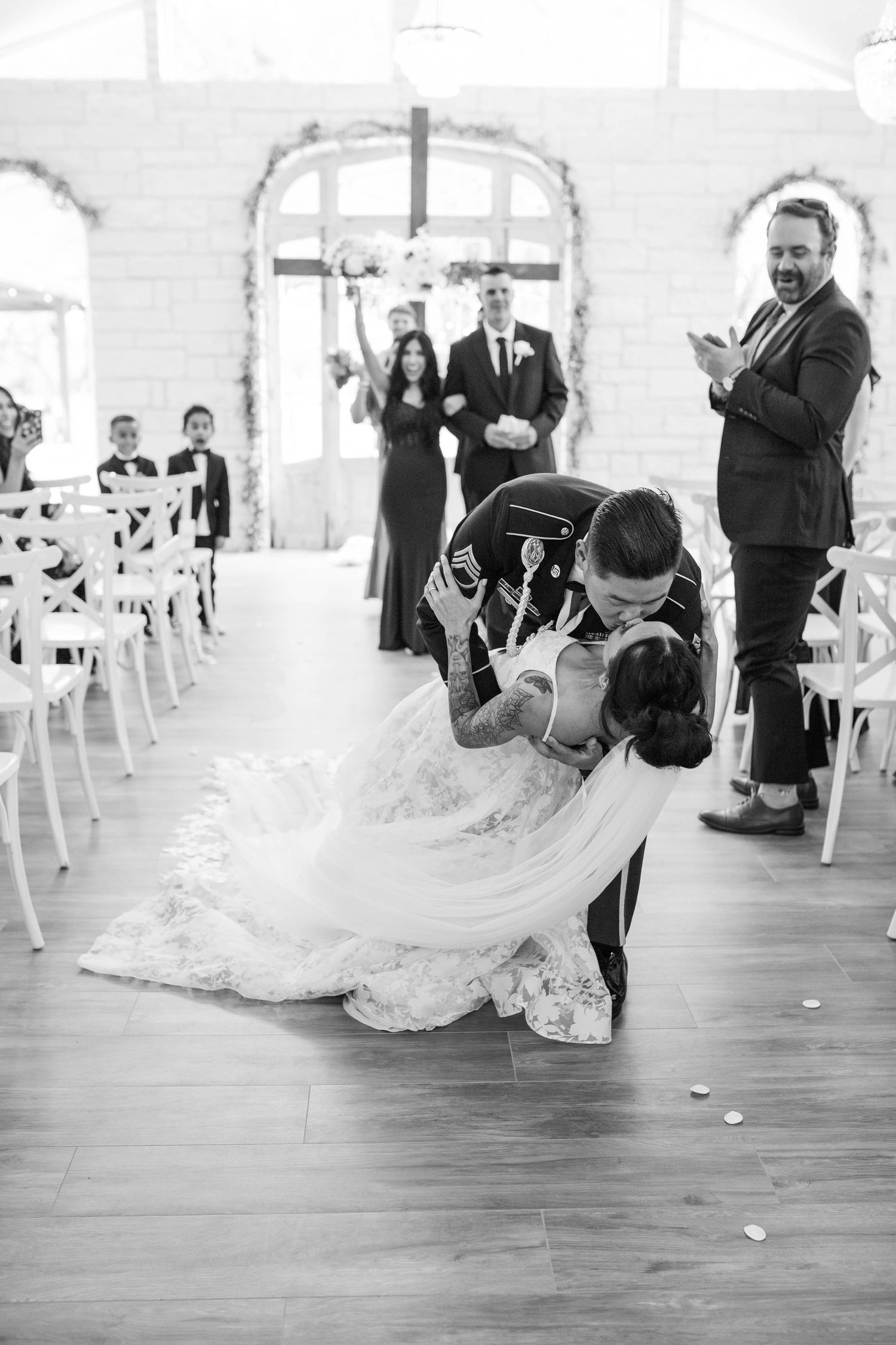 A black and white photo sequence shows a couple performing a dramatic dance dip at a wedding reception.