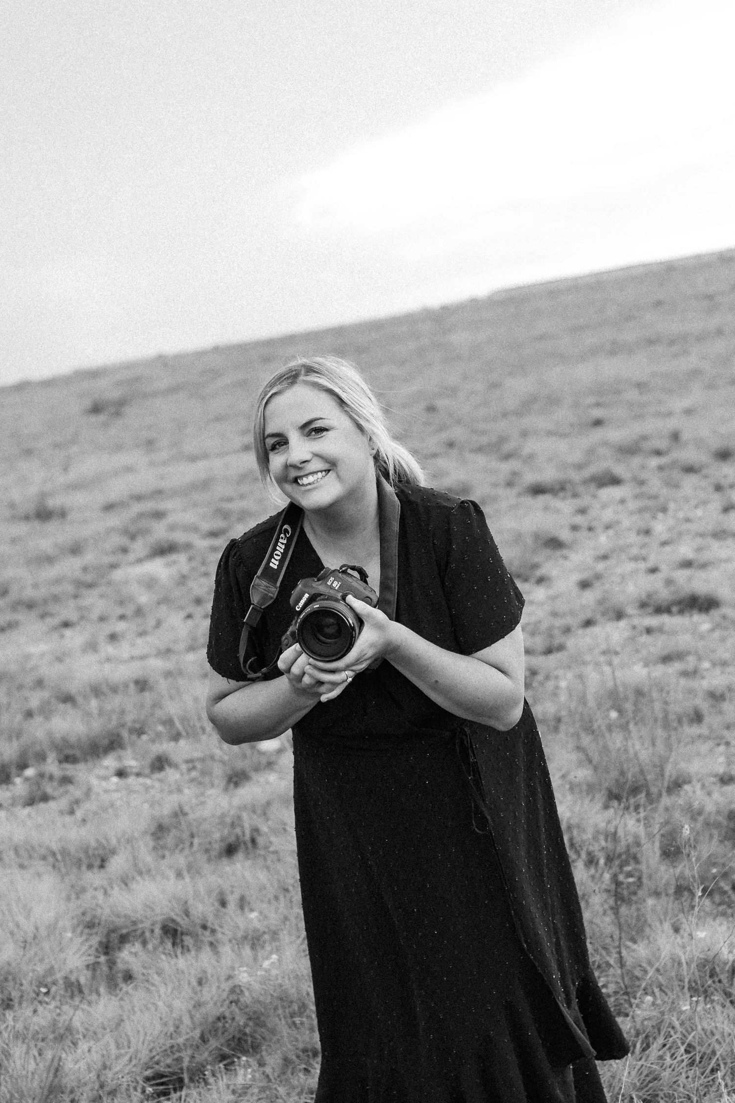 A black and white photo sequence shows a person in dark clothing taking photos in a grassy field landscape.
