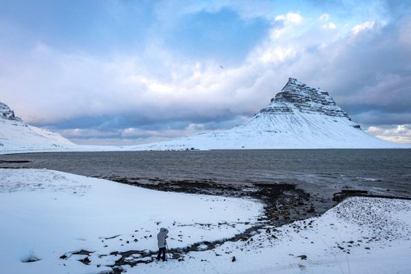 Photographer Mark Swanson standing in winter landscape.