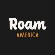 Roam America logo with handwritten white brand name and golden subtitle text on a dark black background.