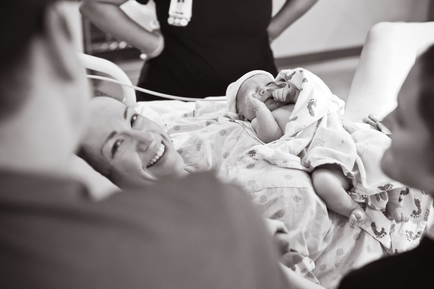 Newborn baby being checked during first medical examination.