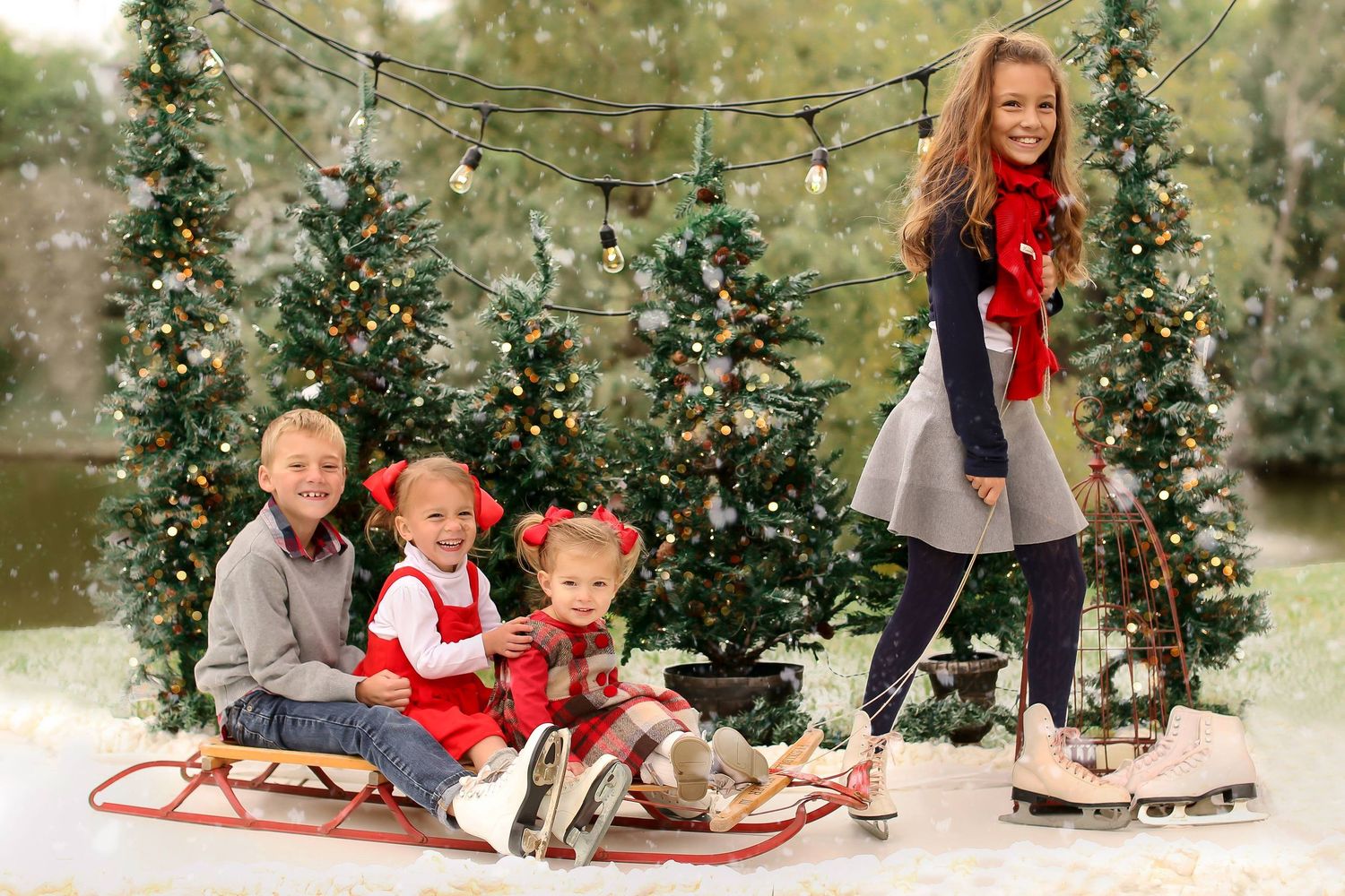 Winter holiday scene with decorated trees and family on vintage sled.