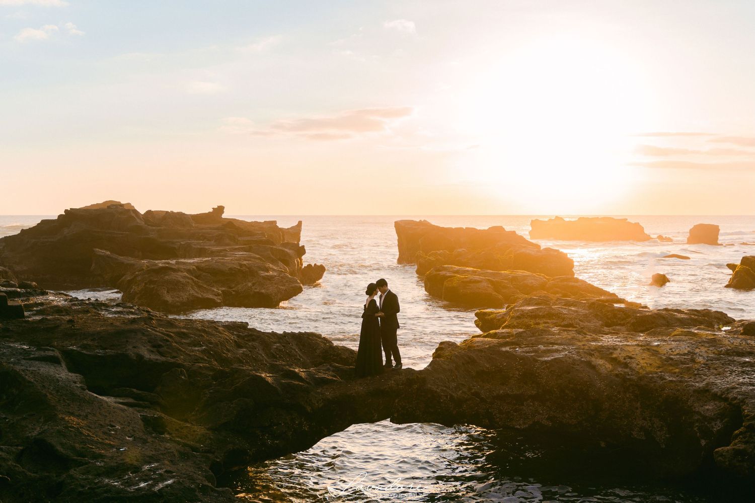 Bali engagement photoshoot in the sunset sea, bali wedding package, bali photographer, bali videographer