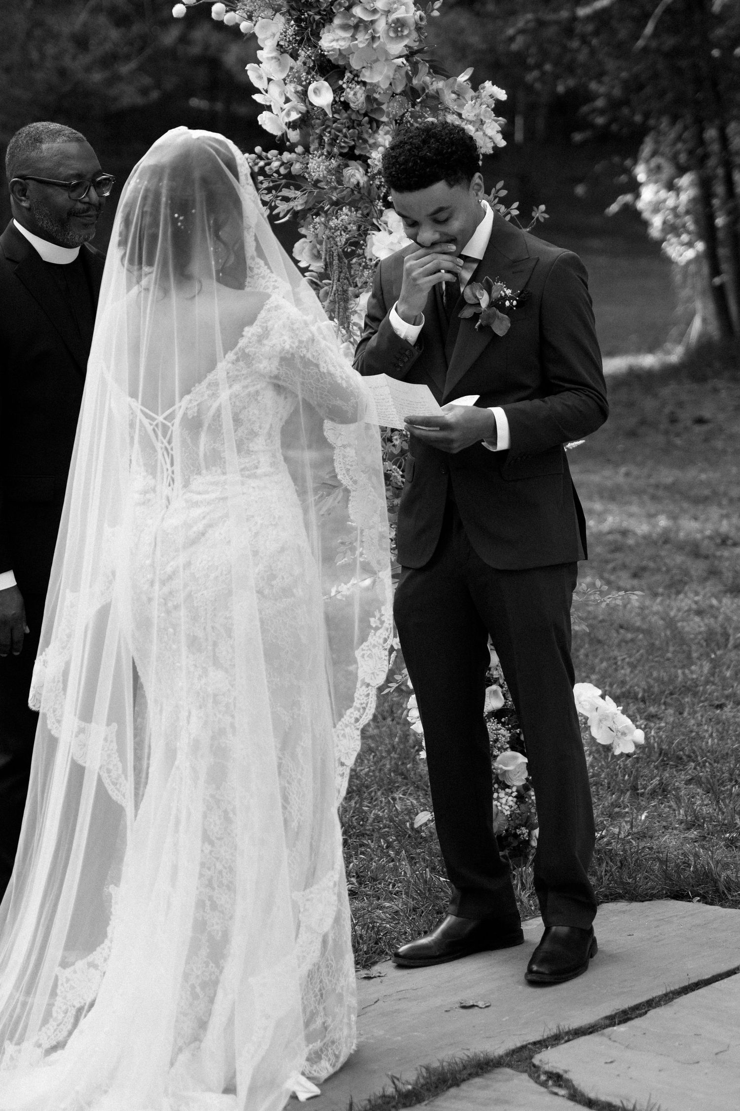 A series of black and white wedding ceremony photos showing a couple during their outdoor vows with flowing veil details.