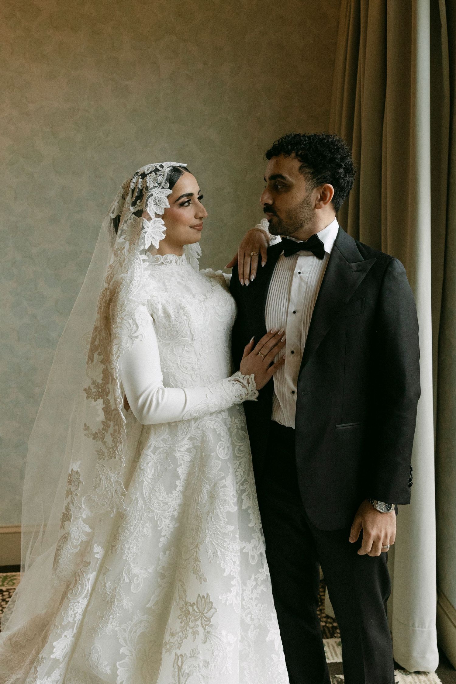 Elegant wedding couple in formal attire share intimate moments against a neutral backdrop in four romantic poses.