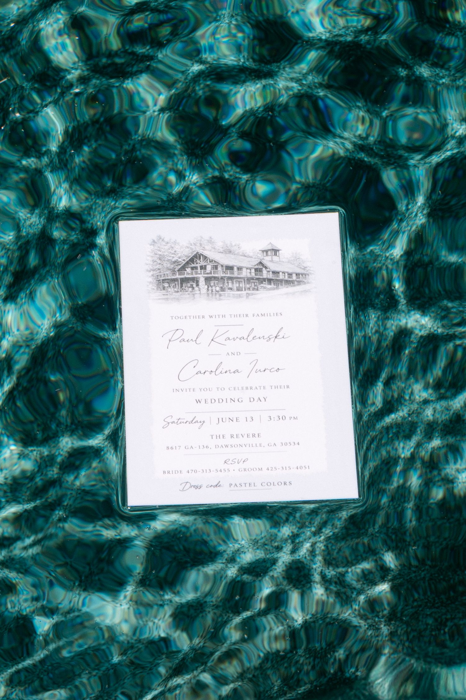 Elegant wedding invitation for Paul Kovalenski and Caroline Ivers displayed on teal water surface with pastel colors dress code.
