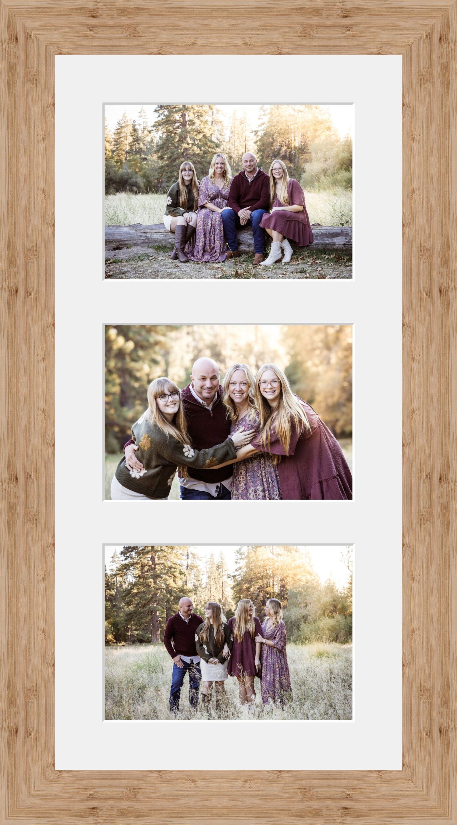Family of four poses outdoors in coordinating burgundy outfits, displayed in a triple-panel wooden frame with white matte.
