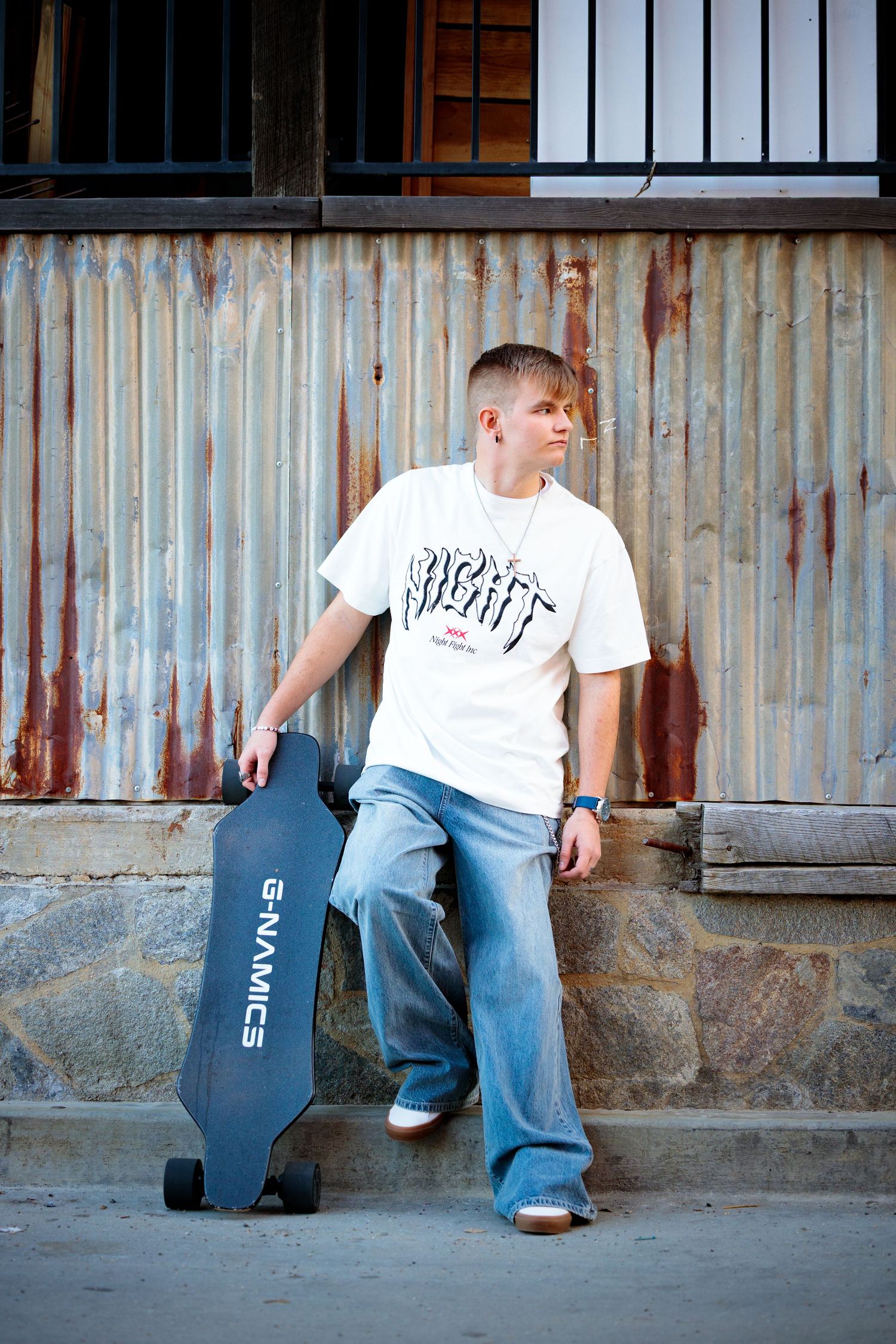 Four sequential photos showing someone in jeans and white t-shirt sitting on concrete steps against rustic metal wall.
