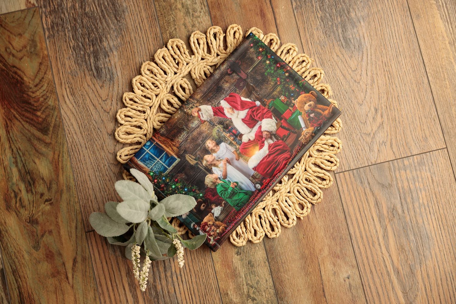 Christmas ornaments and decorations scattered across a wooden floor in a festive holiday display.