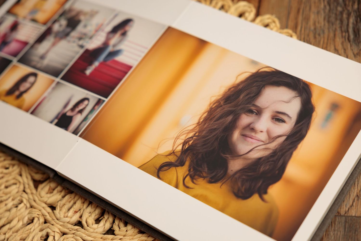 Multiple portrait photographs laid out on a wooden surface with warm lighting and orange tones in the background.