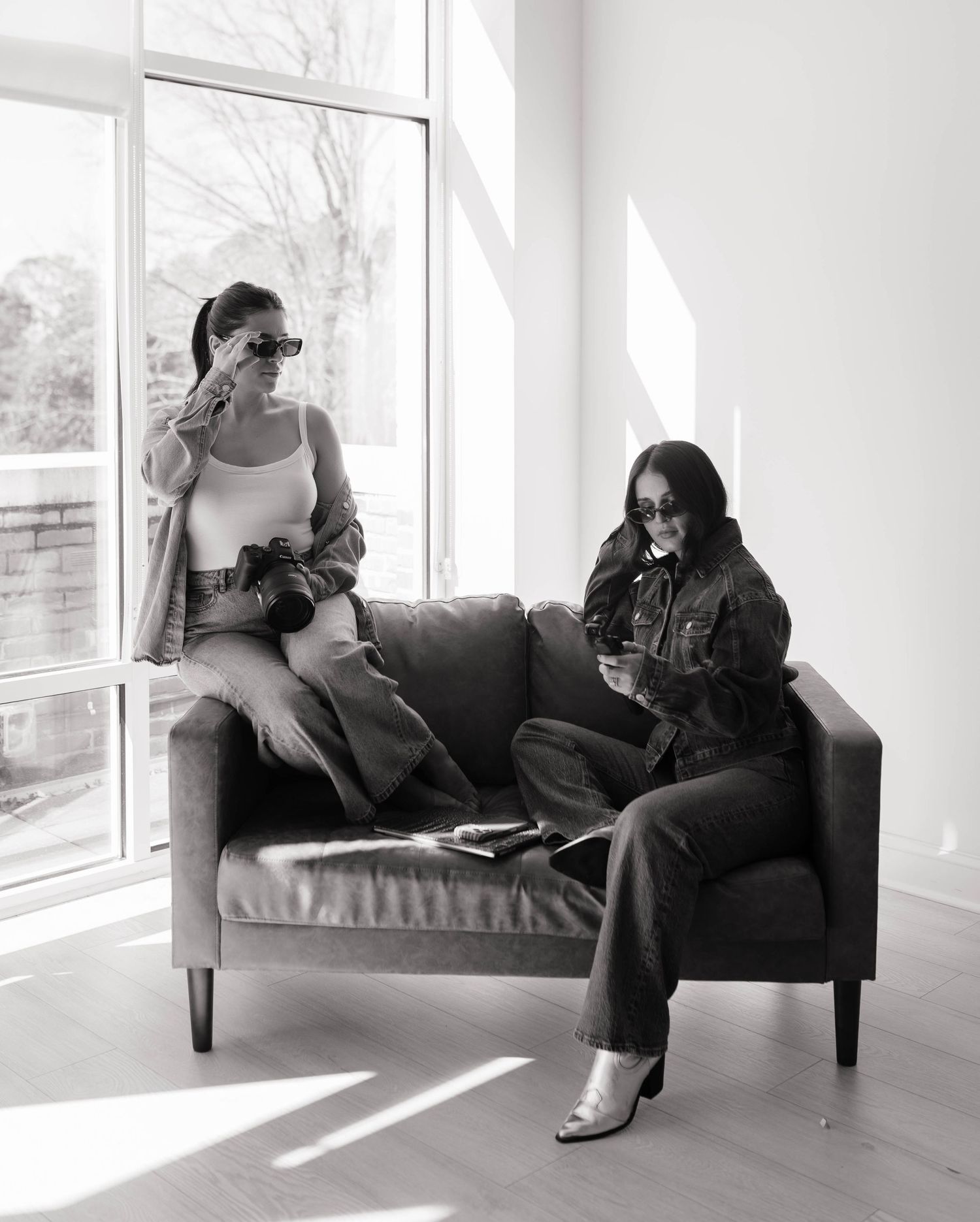 A series of black and white photos showing someone lounging on a chaise sofa in different relaxed positions near a window.
